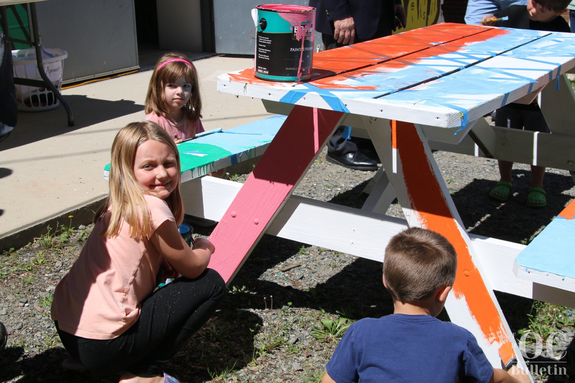  Kids and families had an opportunity to paint a section of the picnic tables located in the community garden. (Photo Credit: Andra Landi) 