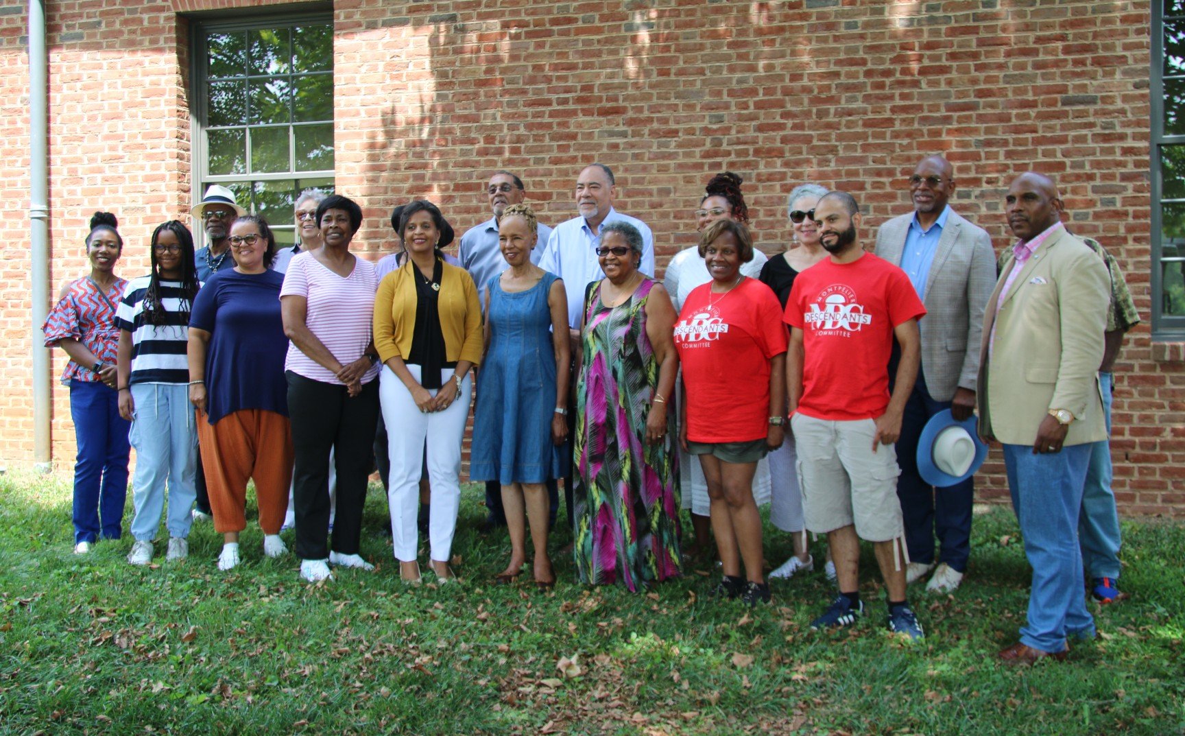  Descendants of the enslaved community stand together for a group picture outside of Montpelier’s visitor center Aug. 5. (Photo Credit: Andra Landi) 