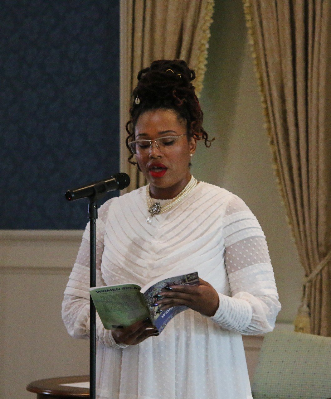  L. Renée reads her poem “The Unmapped Place” during Montpelier’s memorialization project kickoff Aug. 5. (Photo Credit: Andra Landi) 