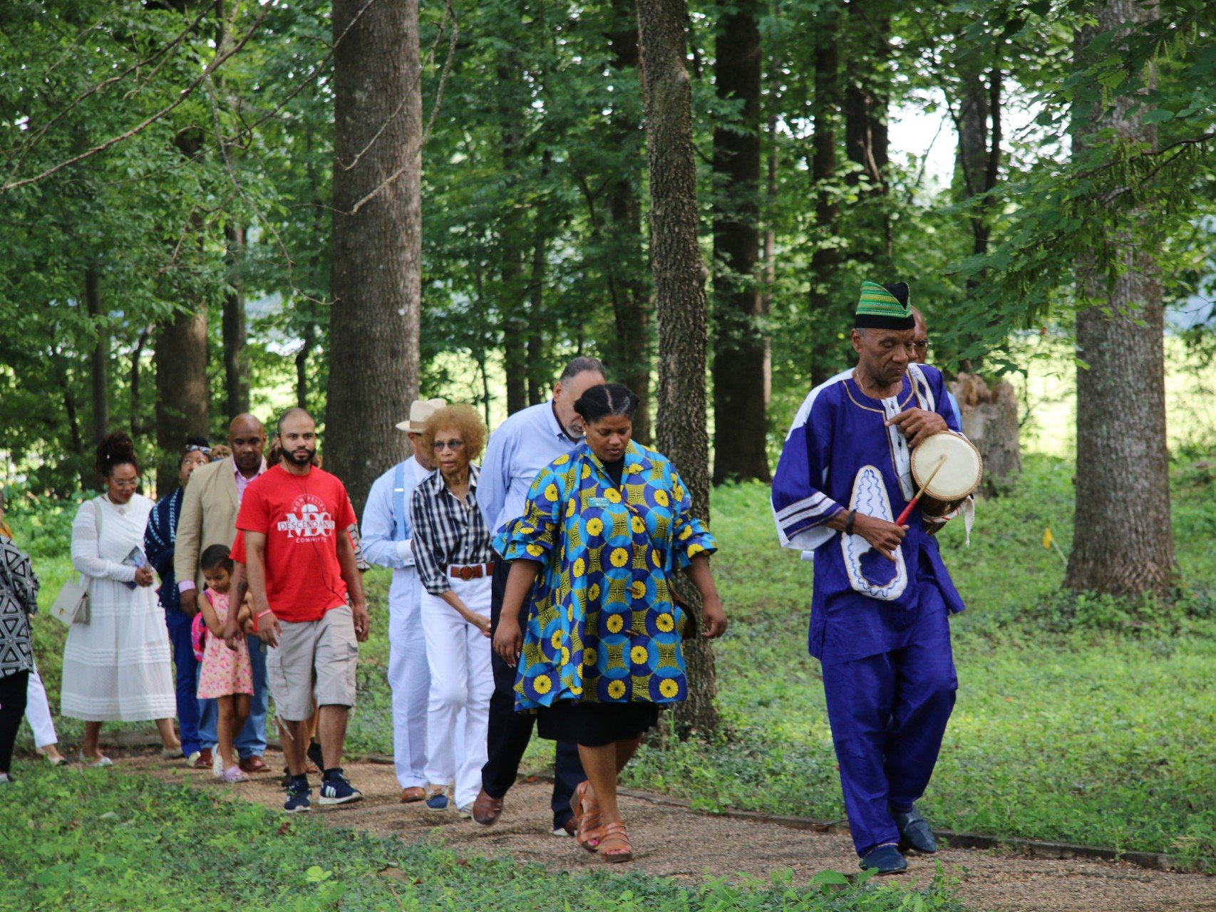  Darrell Rose leads descendants, guests and staff through the burial site of enslaved persons at Montpelier during a libation ceremony Aug. 5. (Photo Credit: Andra Landi) 