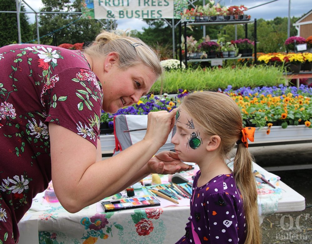  A young attendee has her face painted at the Deep Roots Fall Festival on Saturday, Oct. 30. (Photo Credit: Andra Landi) 