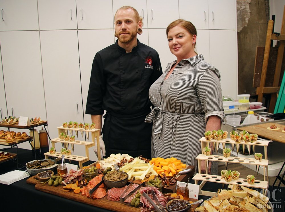  Left to right: Forked On Main chef Dennis Merritt and owner Stephanie Saperstein provided a generous spread of hors d’oeuvres during the Oct. 5 opening reception at The Arts Center In Orange. (Photo Credit: Andra Landi) 