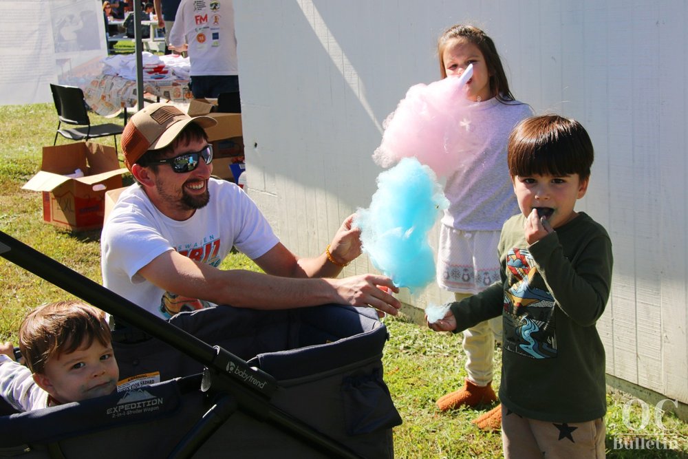  The Collier family shares some cotton candy at the Gordonsville Famous Fried Chicken Festival on Oct. 7. (Photo Credit: Andra Landi) 