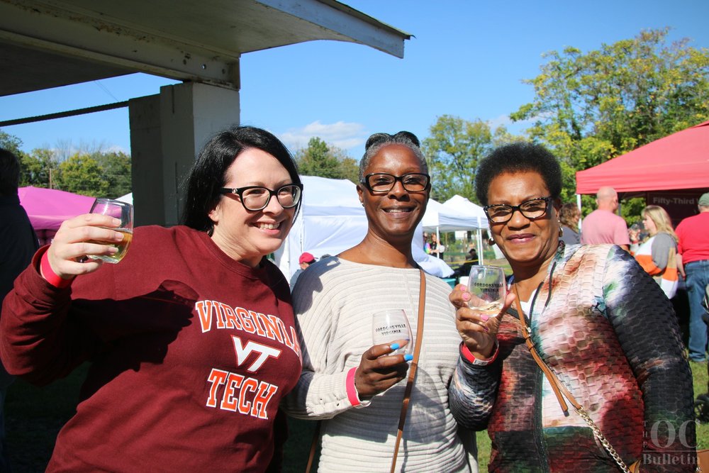  From left to right: Amanda Knighting, Derricka Long and Mary Long enjoy their time in the wine garden at Saturday’s festival. (Photo Credit: Andra Landi) 