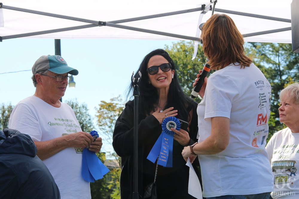  Sonia Uray, winner in the pie contest’s cream category, accepts her blue ribbon. (Photo Credit: Andra Landi) 