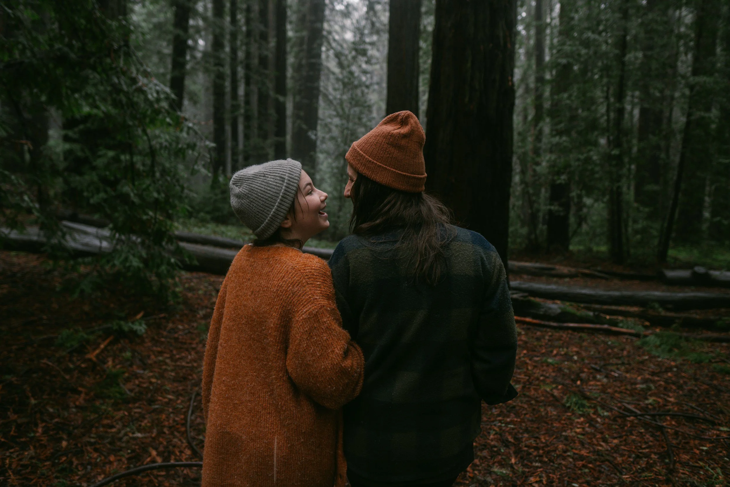 A child and mom in a Burnaby BC forest, talking about trauma therapy and perinatal counselling.