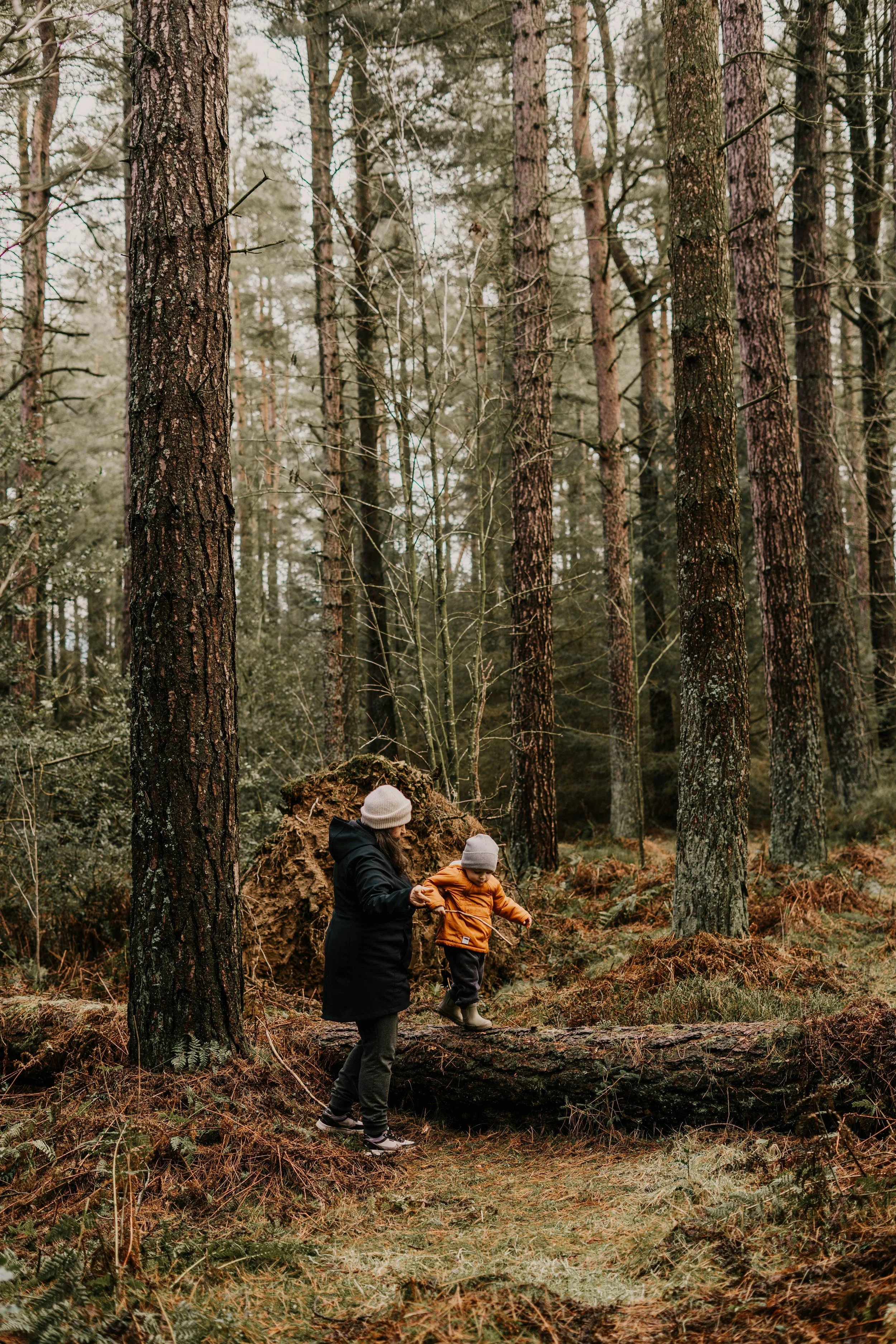 A child and mom walking on a Burnaby BC trail, discussing grief therapy and perinatal counselling.