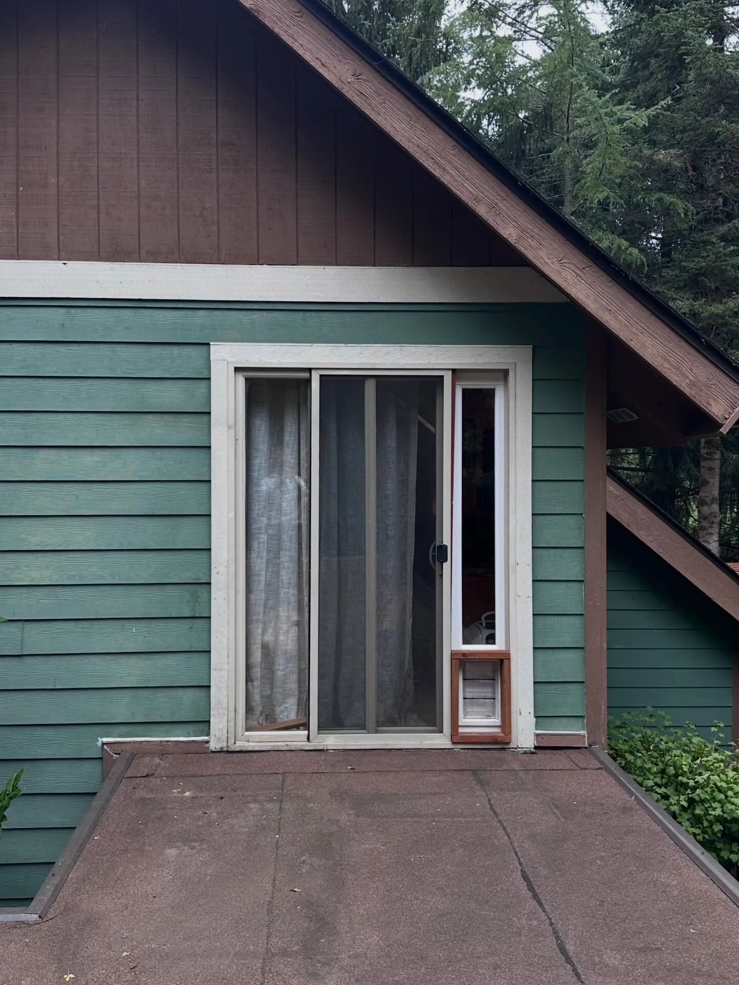 Built a custom catio for a client on their upper deck &mdash; 2x2 frame, polycarbonate roof, screen panels, and a cat door that connects directly to their sliding door so the cats can come and go on their own. 

If your cats are staring out the windo