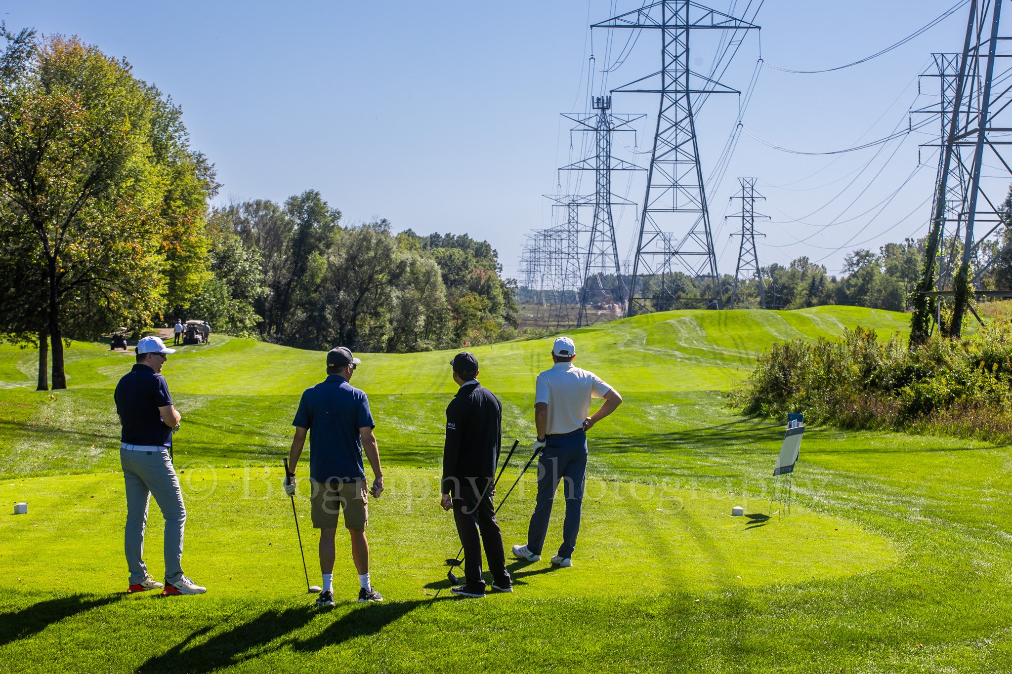  golfers tee shot boy scouts golf outing michigan 