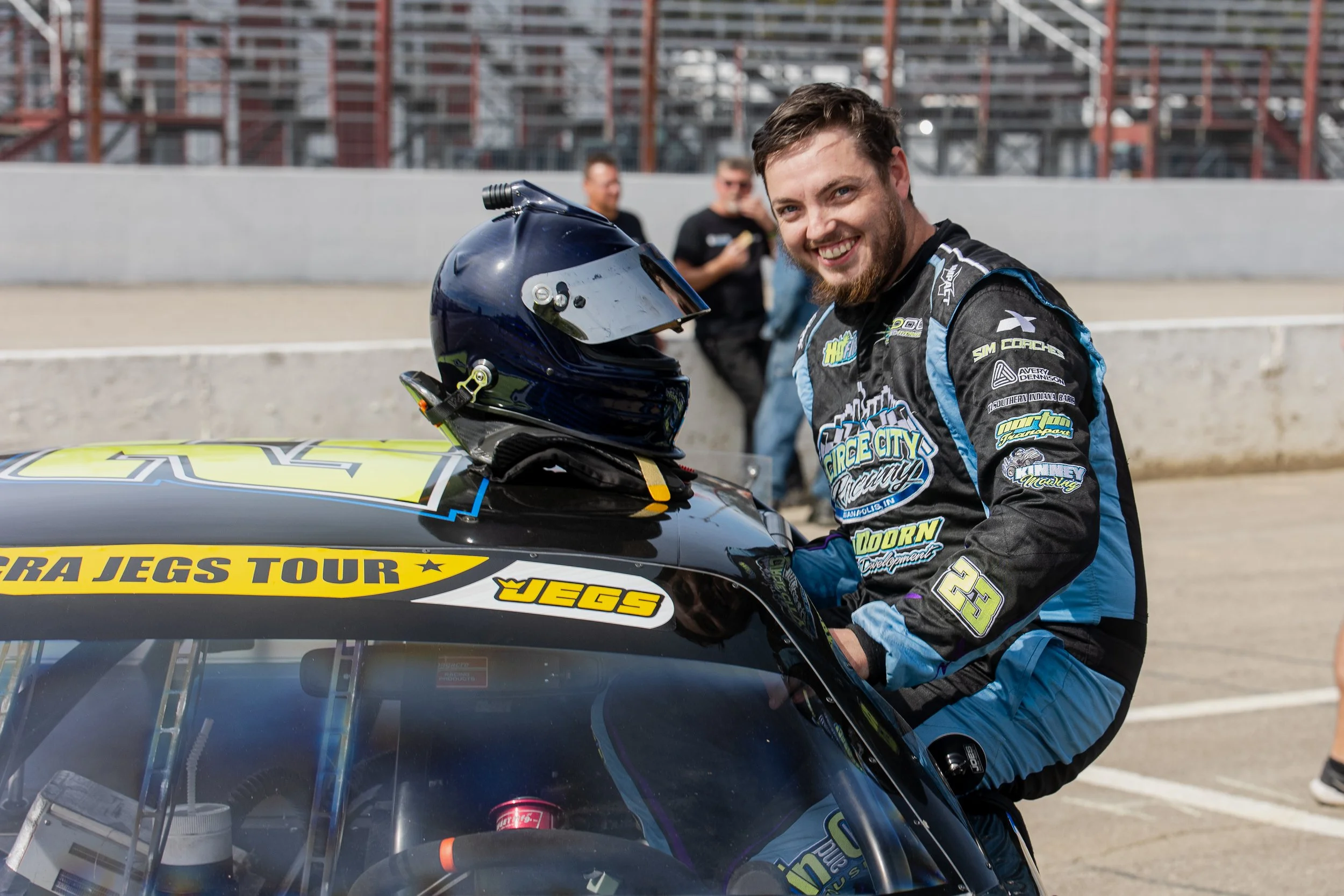 an image of a race car driver getting out of his late model race car at  Winchester Speedway in Indiana taken by a professional motorsport photographer