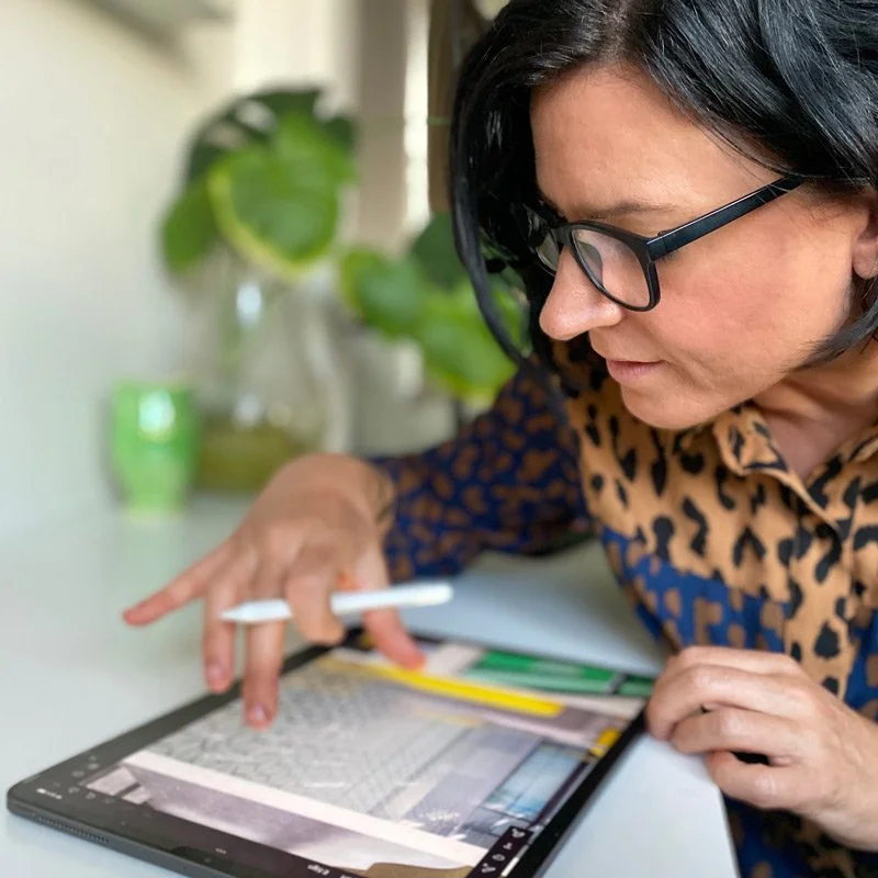 Creative consultant working through brand concepts and visual ideas on a tablet