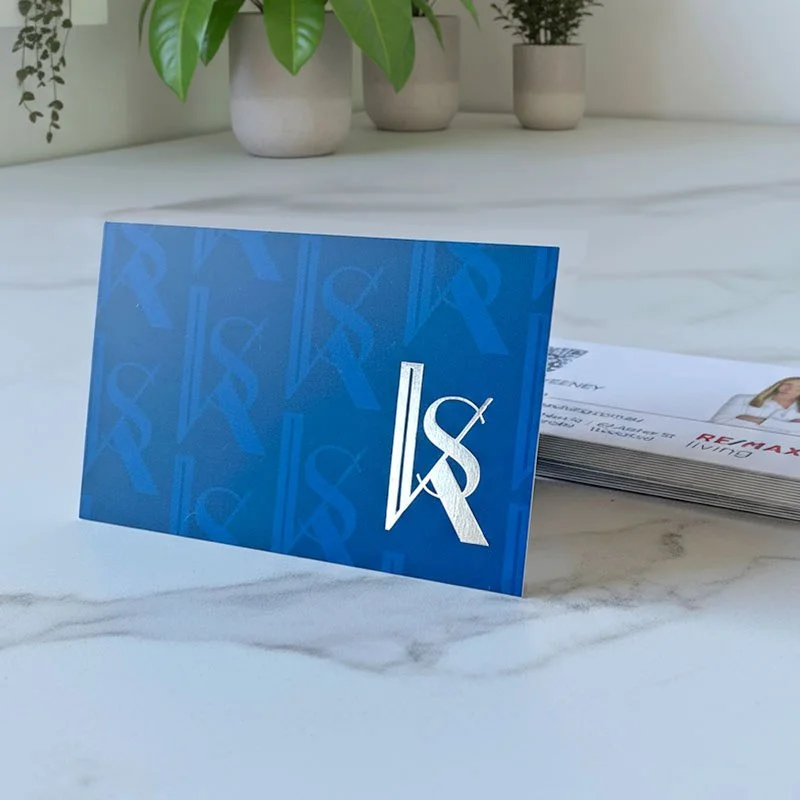 Luxury business card for real estate agent with silver foil detail