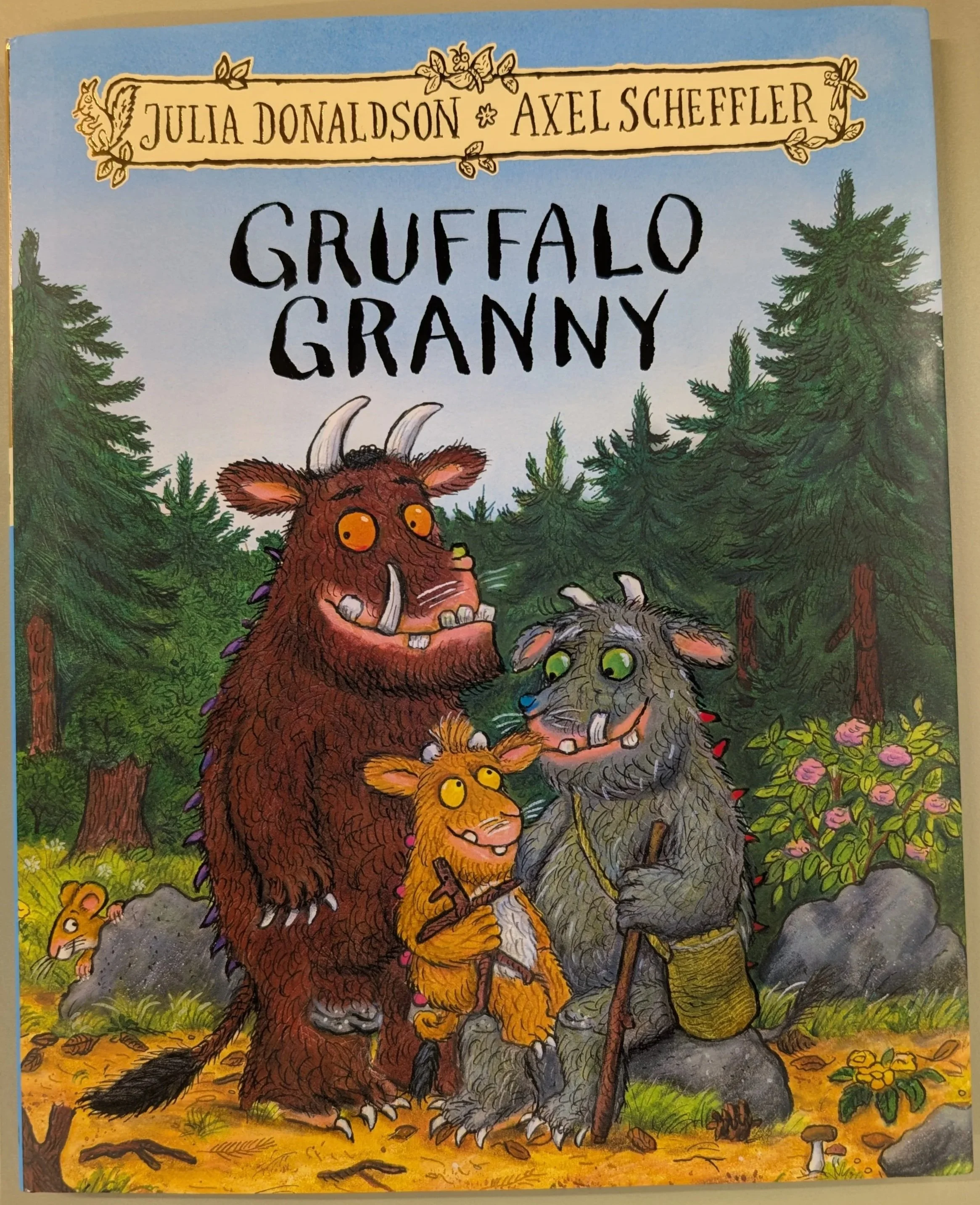 Front cover image of 'Gruffalo Granny' book, by Donaldson and Scheffler. Featuring full images of Gruffalo, the Gruffalo's Child and Granny Gruffalo posed together