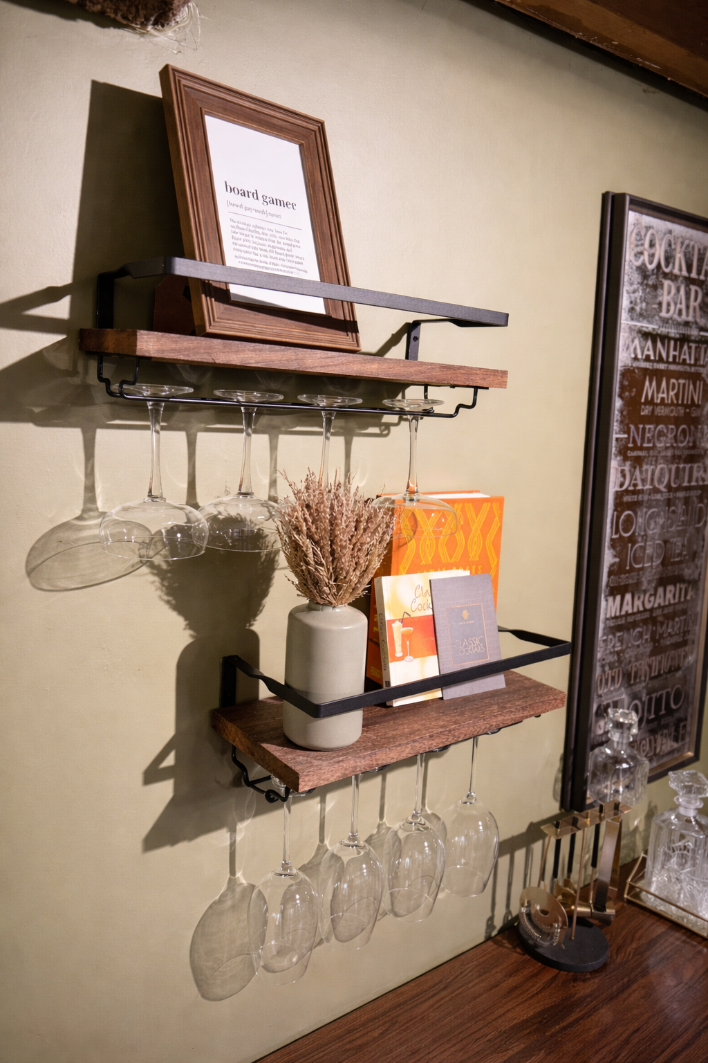 A stylish, compact bar vignette featuring warm timber shelving with black metal brackets, designed to neatly display glassware and curated accessories. Set against a soft, muted backdrop, the arrangement combines function and styling, with hanging wi