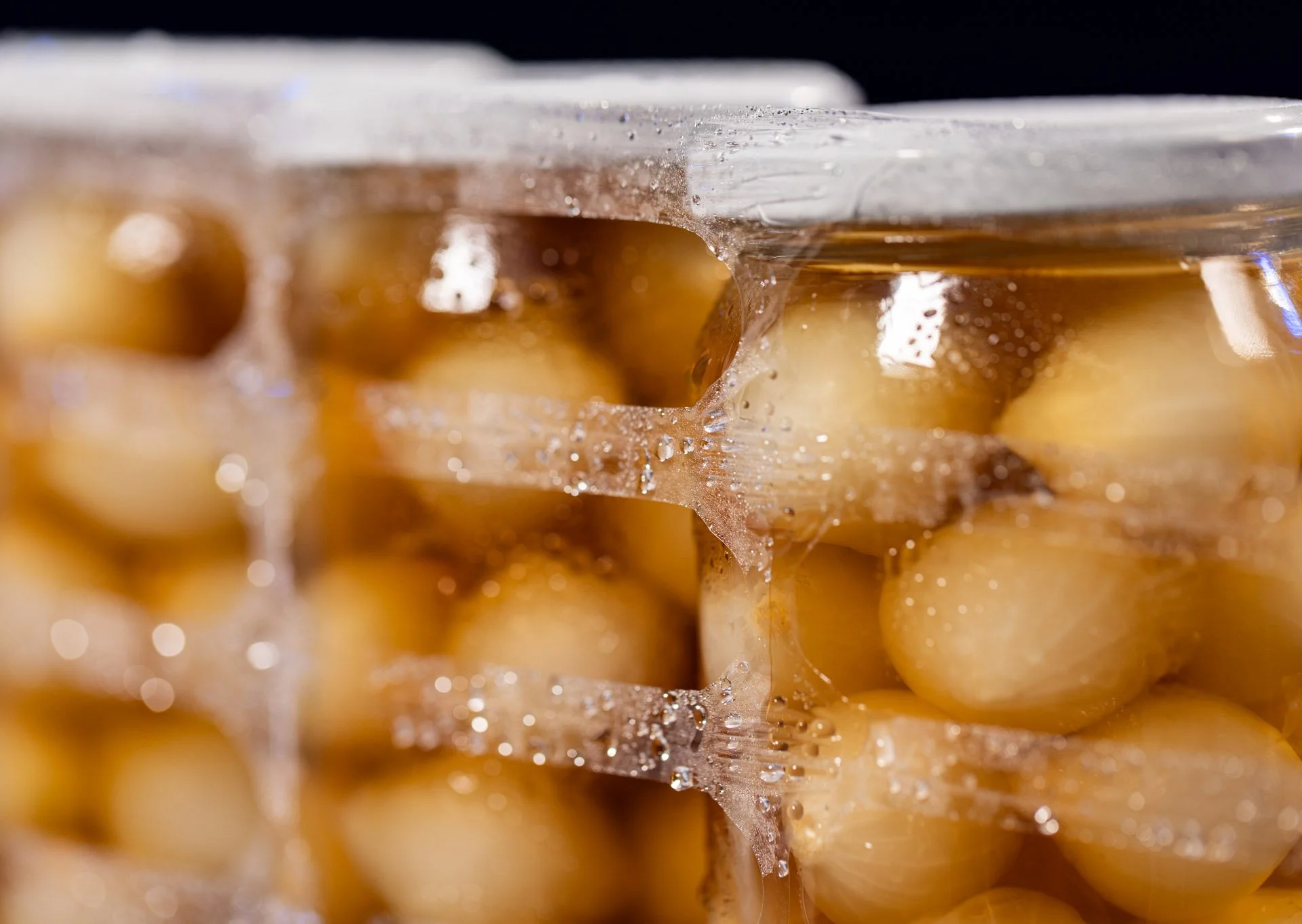 Glass jars of pickles and chutneys wrapped in ExcelAir ventilated pallet wrap preventing moisture and label damage