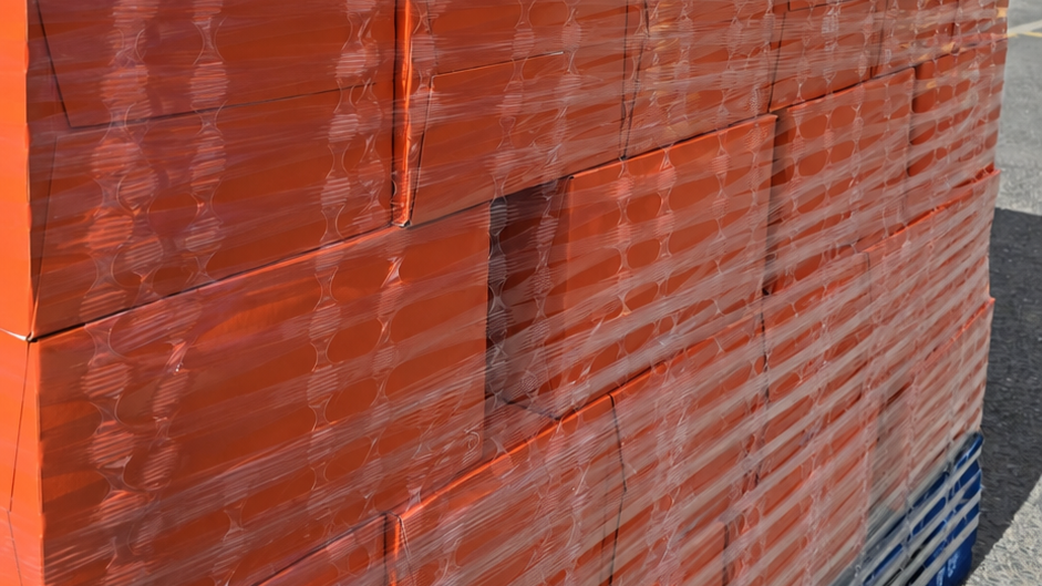 A pallet of drinks wrapped in ExcelAir perforated pallet wrap.