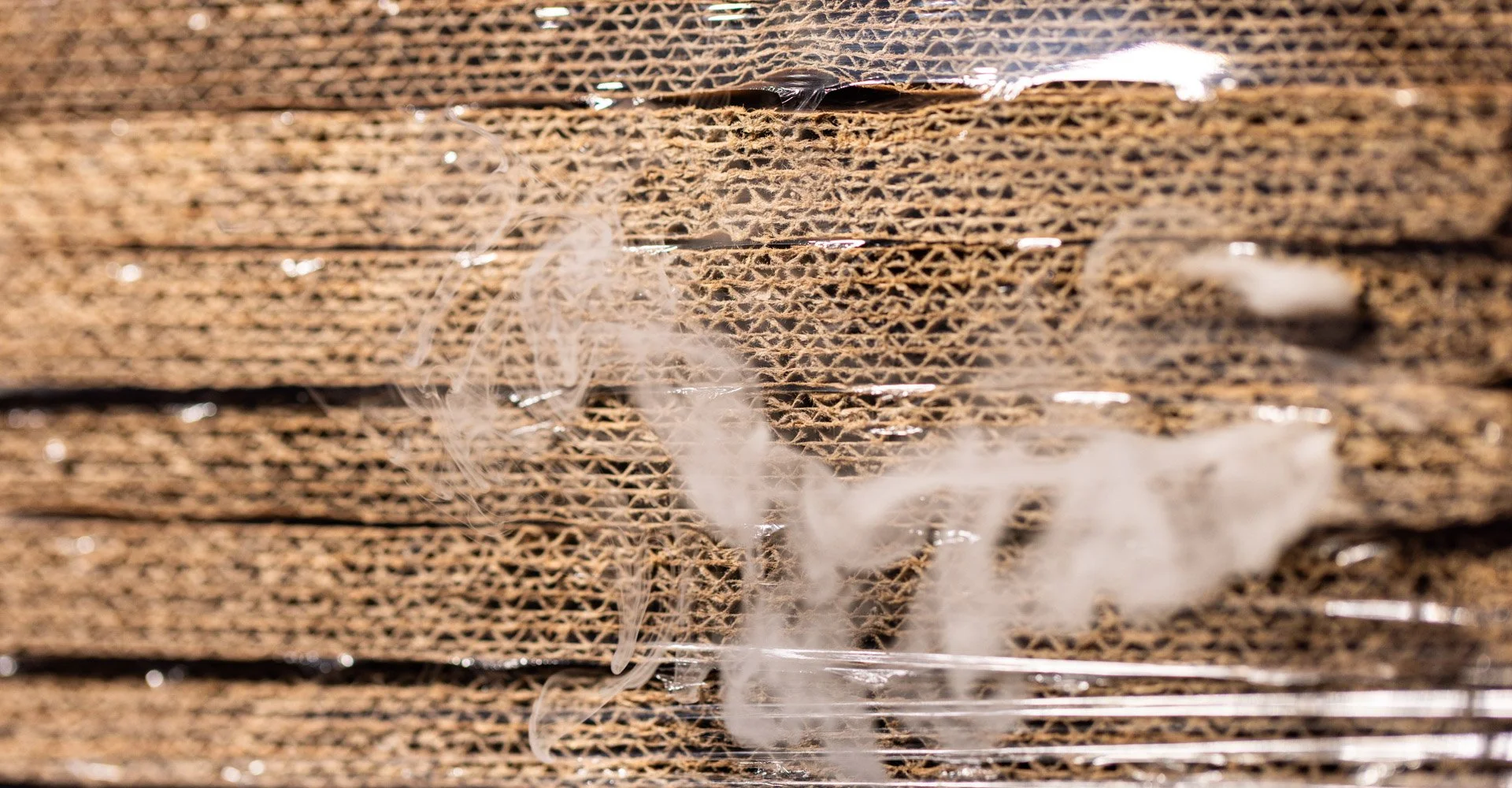 Cardboard and corrugated sheets wrapped in ExcelAir ventilated pallet wrap to expel heat and improve despatch efficiency