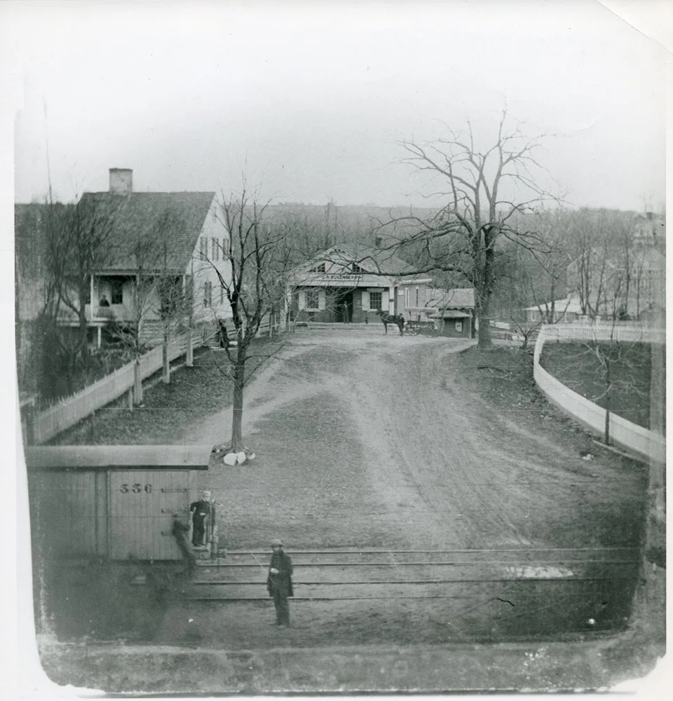 Pic-54 (Looking West on Main St. Building straight ahead is the Dusenberry General Store). Railroad tracks in foreground.
