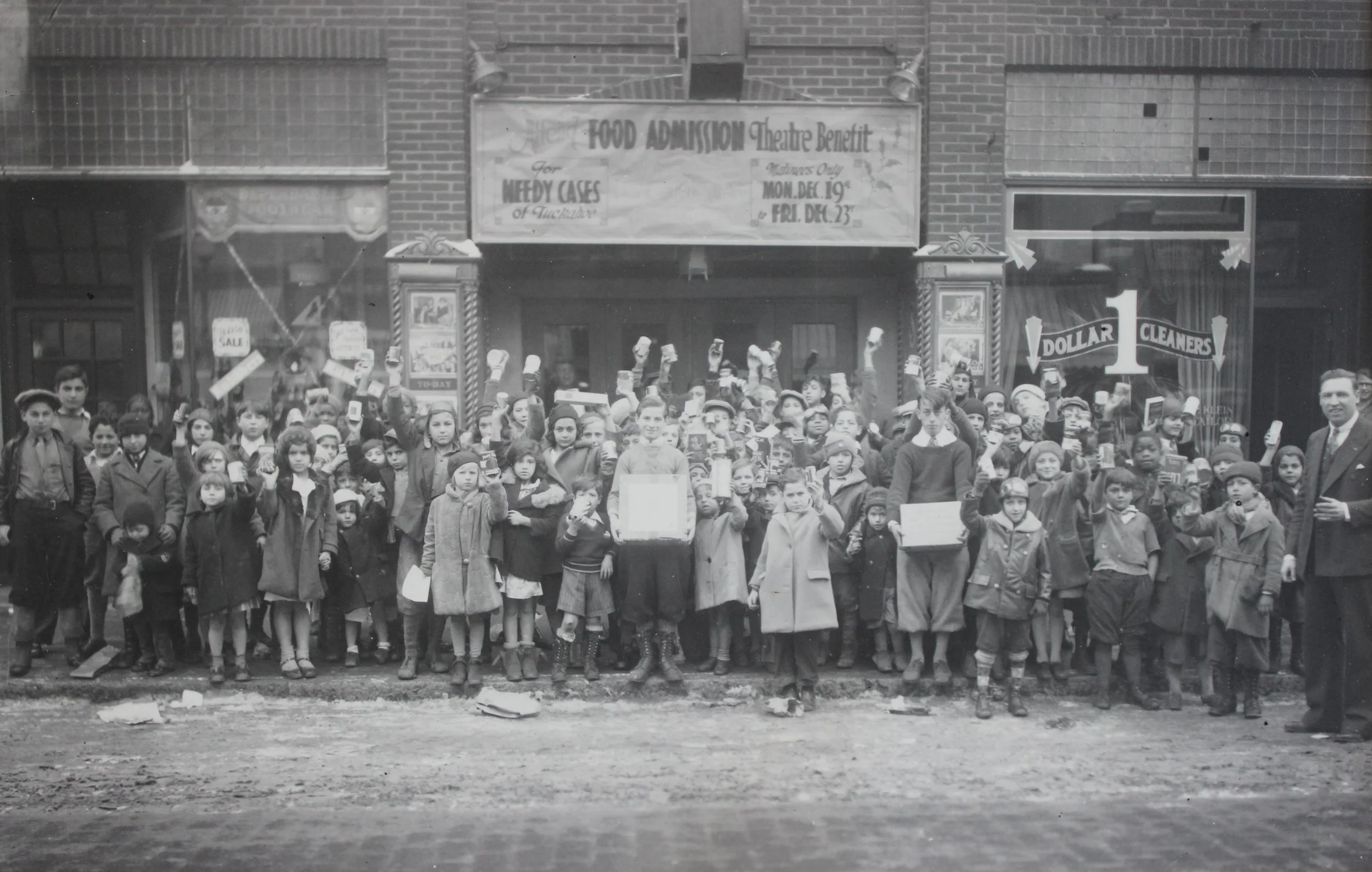 Pic-138 (Front of Lyric Theater, Food Drive, right side is Walter Leonhardt, owner of the theater ~1935)