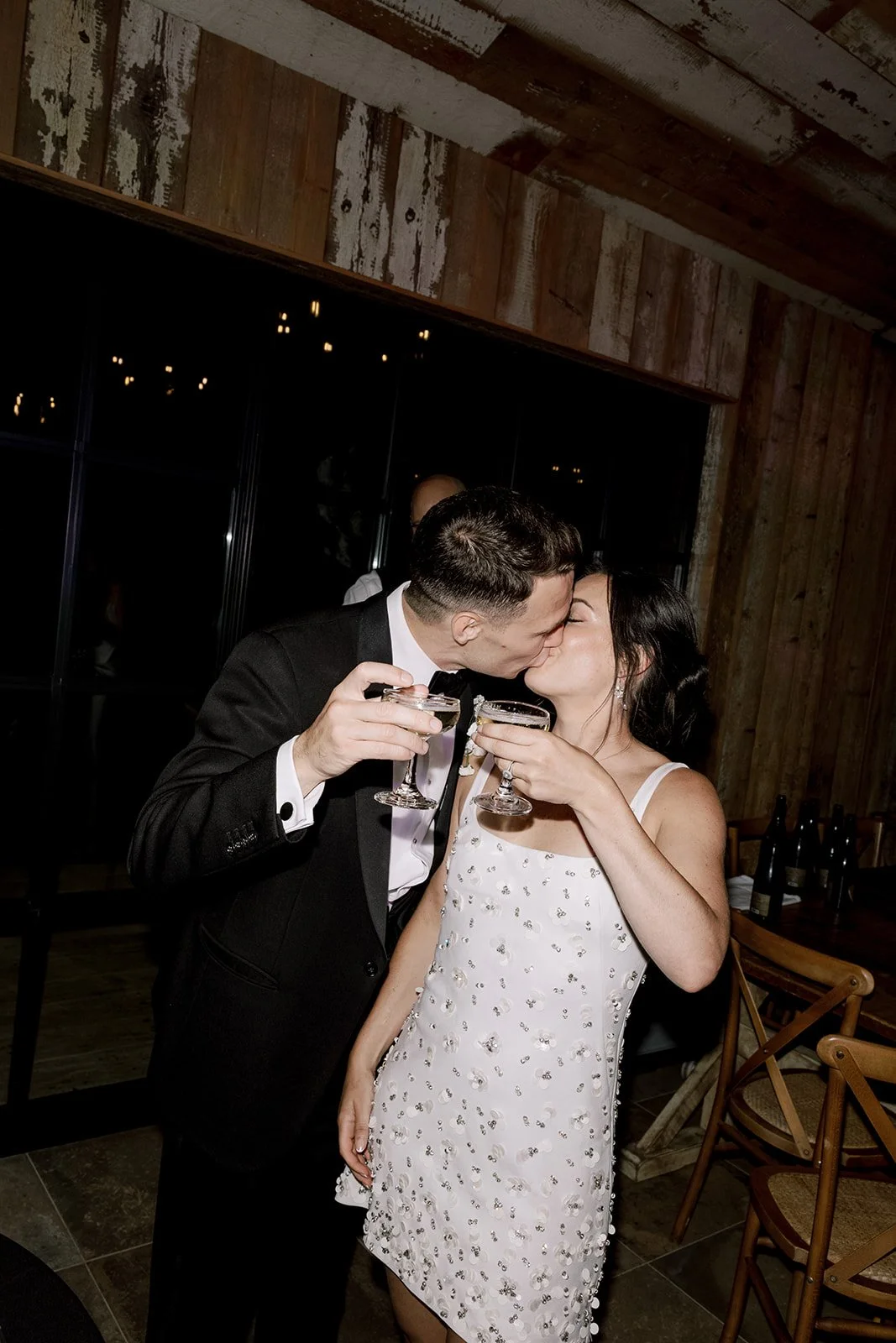 bride and groom kissing at their botley hill barn wedding in Surrey