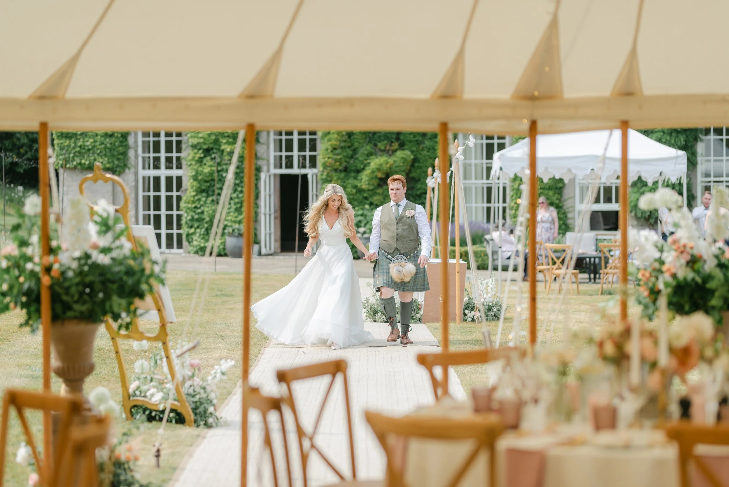 Bride and Groom enter marquee in West Sussex