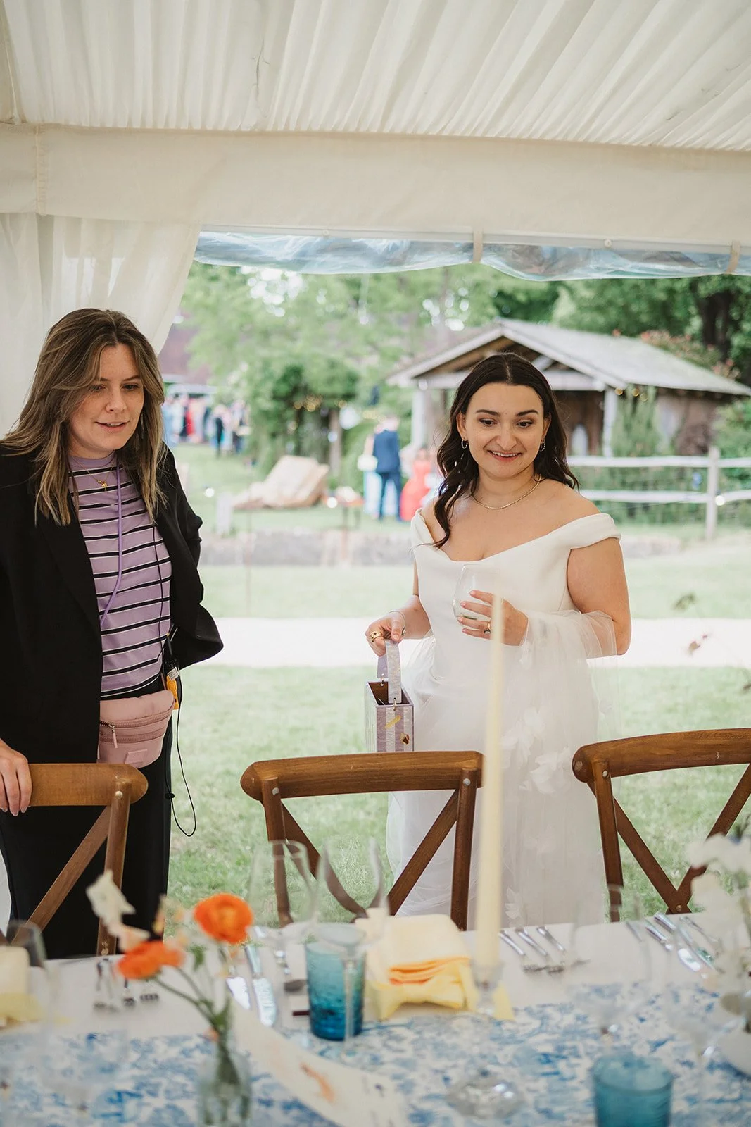 Emma showing the bride her marquee dinner space