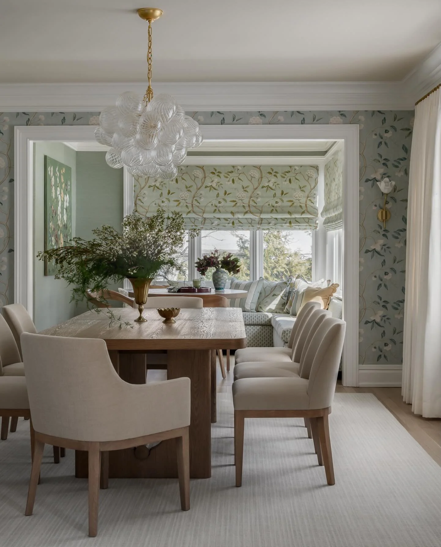 Soft florals, layered patterns, and a palette pulled straight from the garden 🌿✨

For this double dining room, we leaned into color and texture to create a space that feels collected, inviting, and connected to the rooms beyond.  We opened up the wa