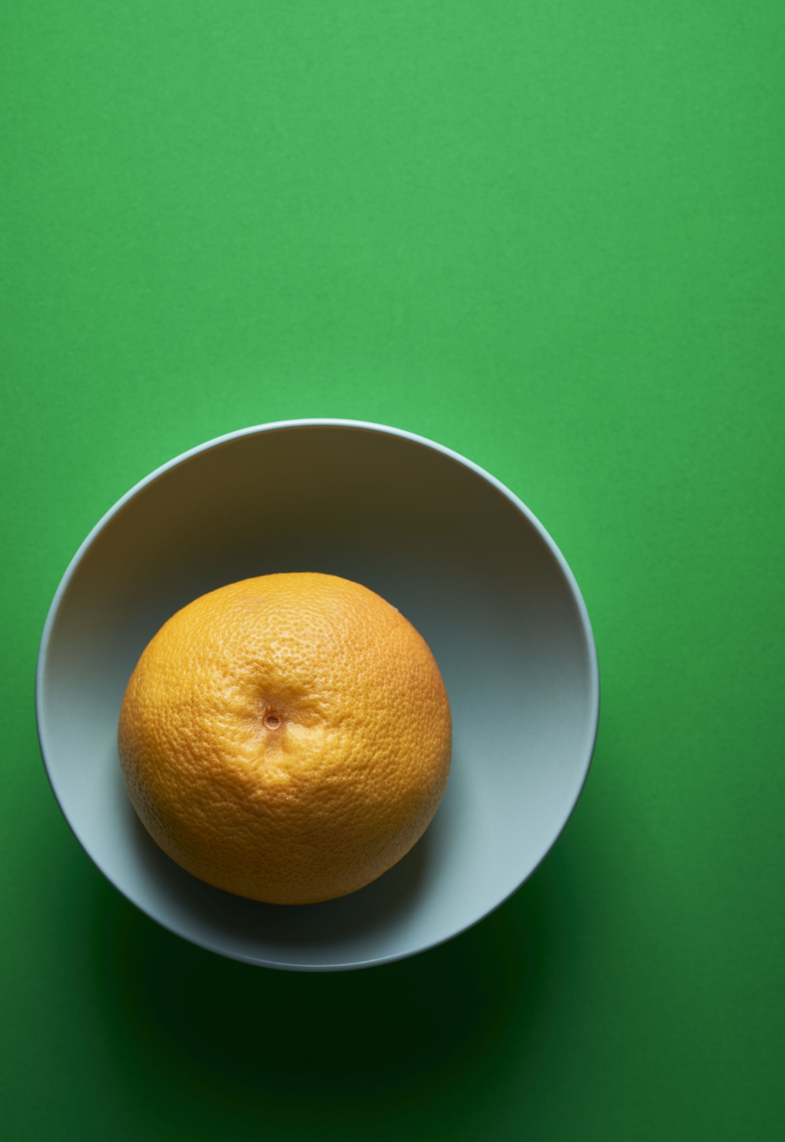 Grapefruit on Green by Lorenzo Tonti. Colourful photographic print A1