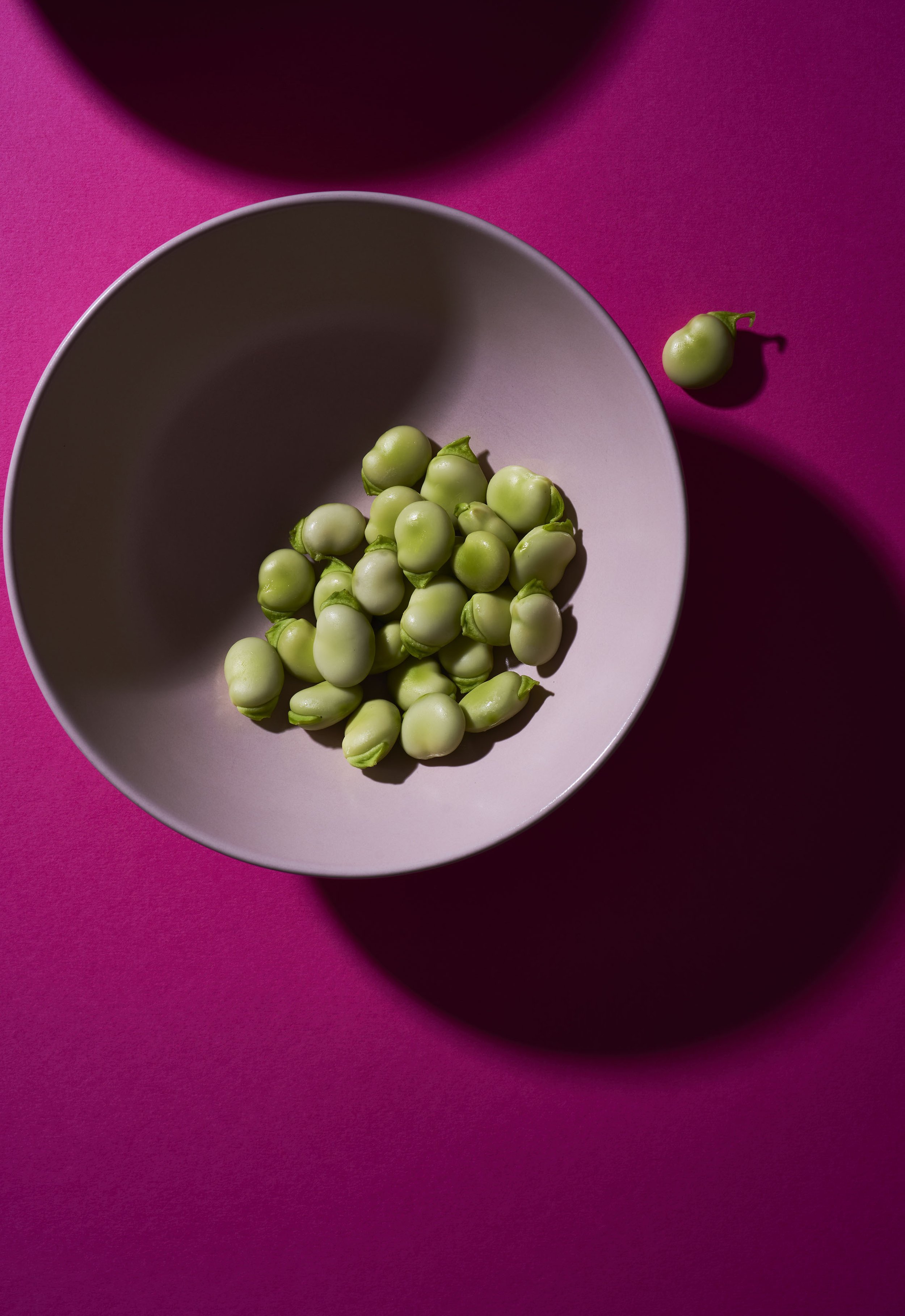 Broadbeans on Magenta by Lorenzo Tonti. Colourful photographic print A1