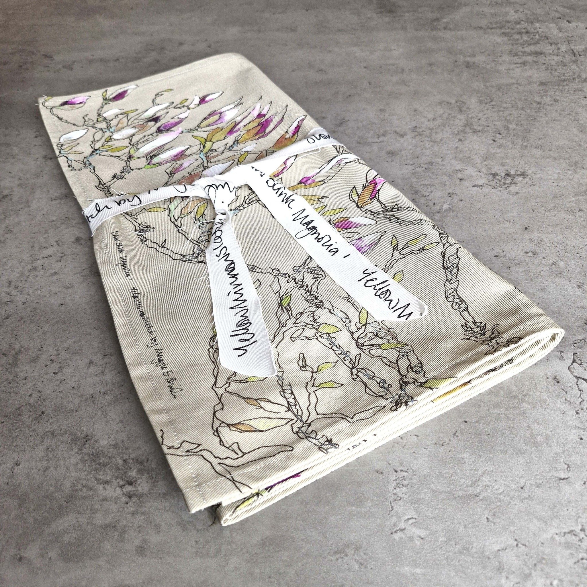 Magnolia Memory:
Artist and product feature:

Maggie Smith&rsquo;s beautifully vibrant drawing of the magnolia tree in her garden, available printed on a soft twill fabric. The 'Slow Blink' Magnolia table runner is developed from the original triptyc