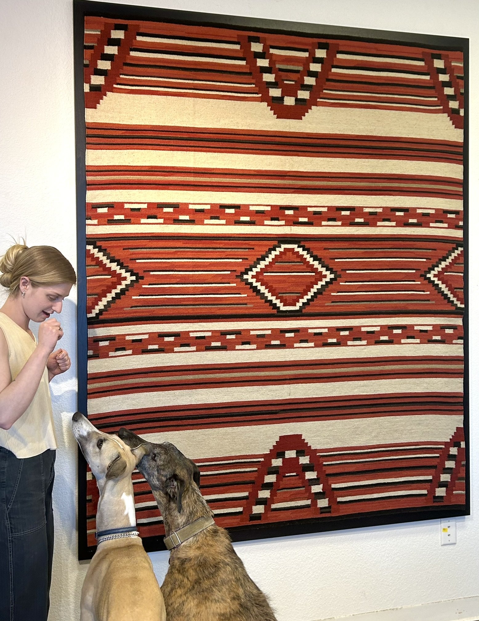 Large stretched Rug floated on wide walnut frame