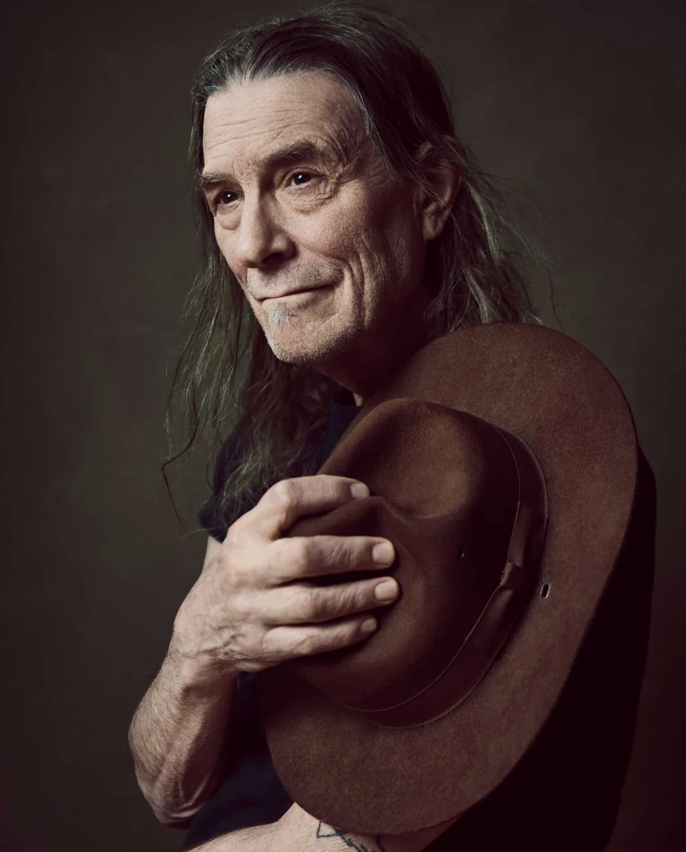 Editorial legacy portrait of Rick Berlin holding hat — Boston musician portrait photographer Craig William Johnston Studio