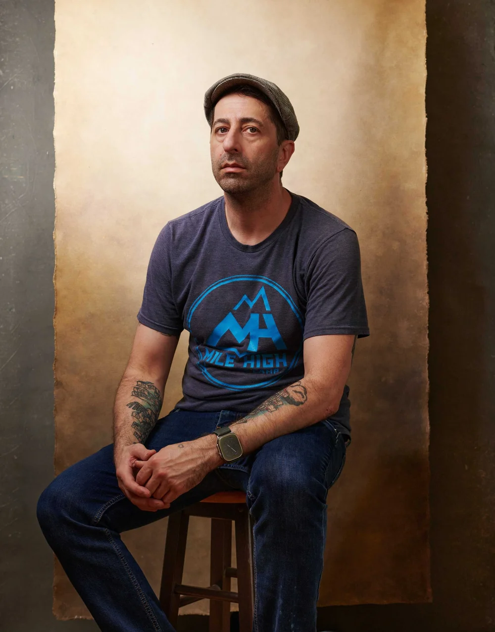 Editorial portrait of a musician in flat cap and t-shirt — Boston musician portrait photographer Craig William Johnston Studio