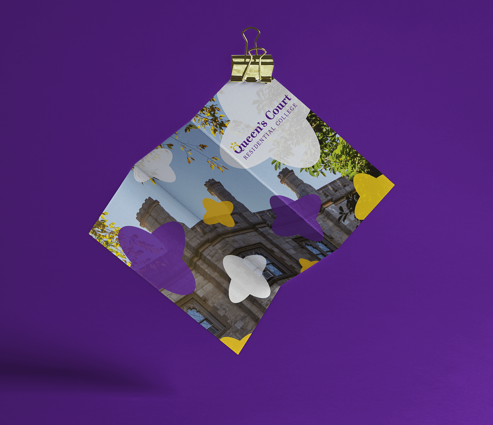 The front of an informational brochure for prospective students. Original photography is overlayed by purple, yellow, and white accents similar to the crown of the "Q" of the logo and wordmark.