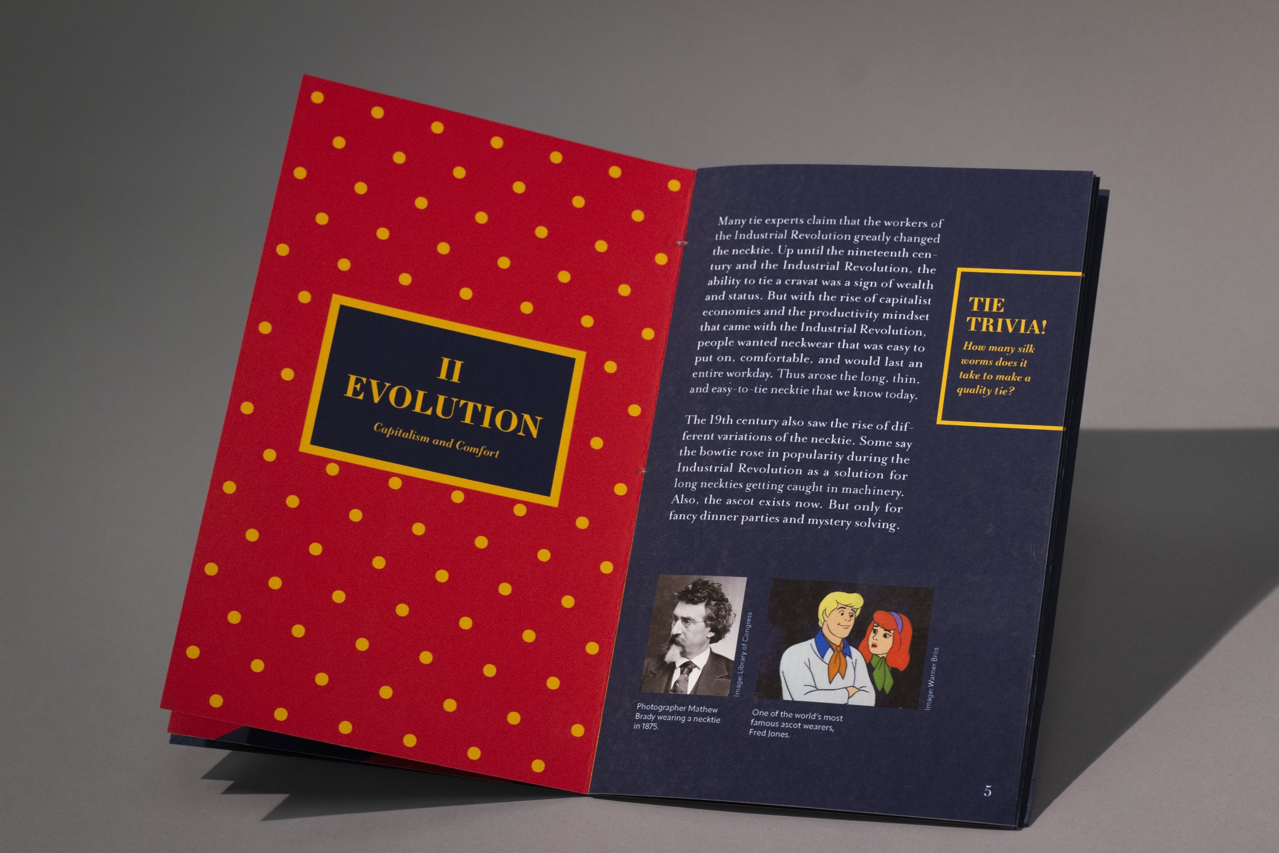 The evolution of the modern necktie. The spread opens on the left with yellow polka dots on a red background. On the rightmost page, the text is white on a navy background. A photo of the one of the first modern neckties is featured, along with a pho