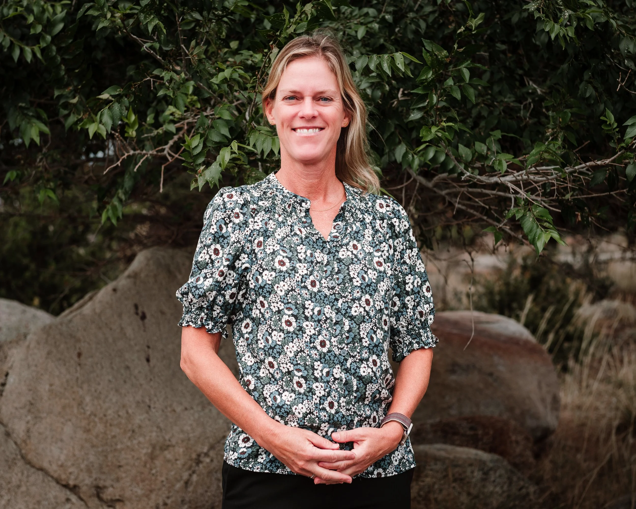 Marissa Buckingham stands in front of fence