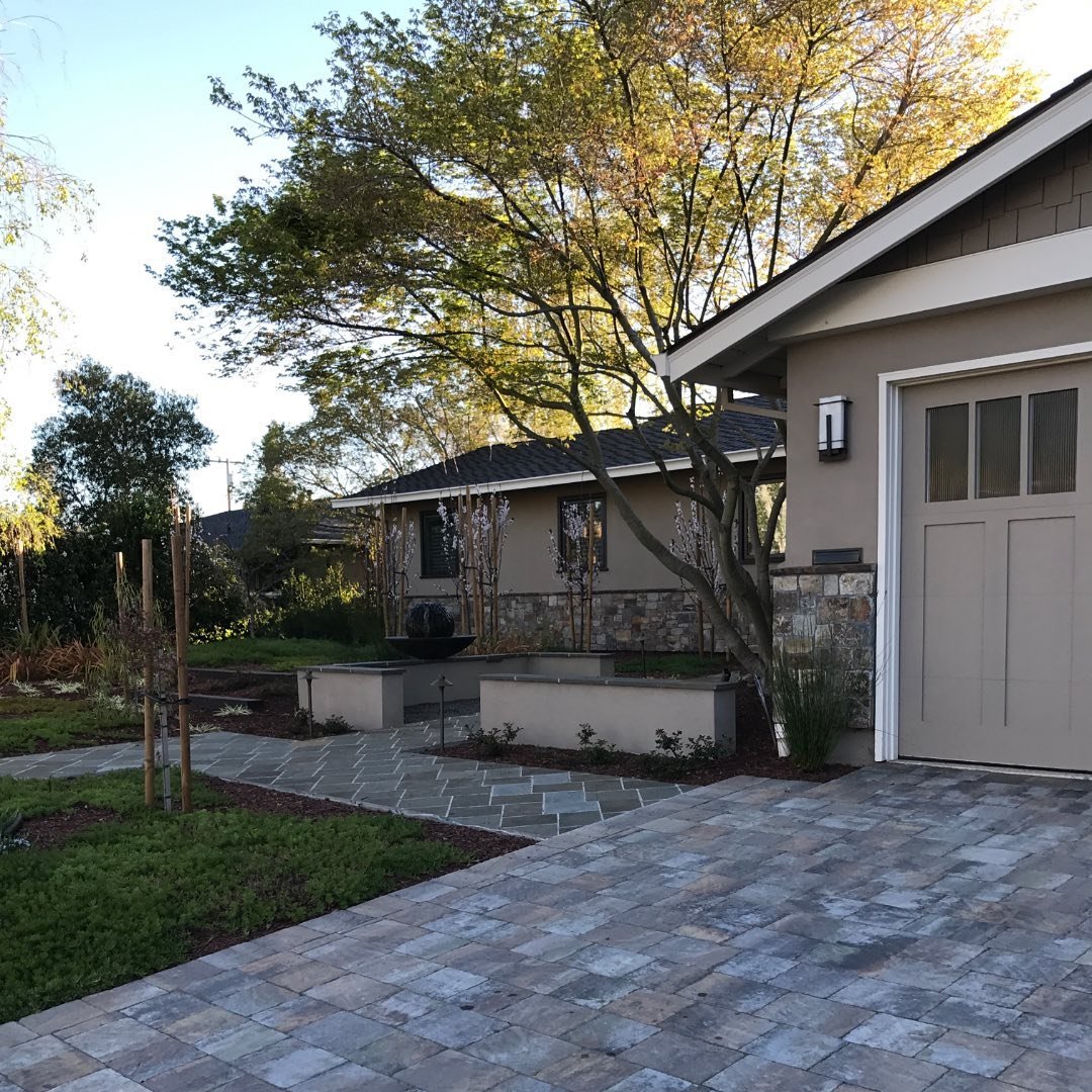 &bull;
Curb appeal.

Curb appeal is balancing welcoming and privacy features. 

This beautiful front yard has a soft courtyard that serves as a focal element and provides a feeling of privacy with seat walls. 

We wanted to feature the existing maple