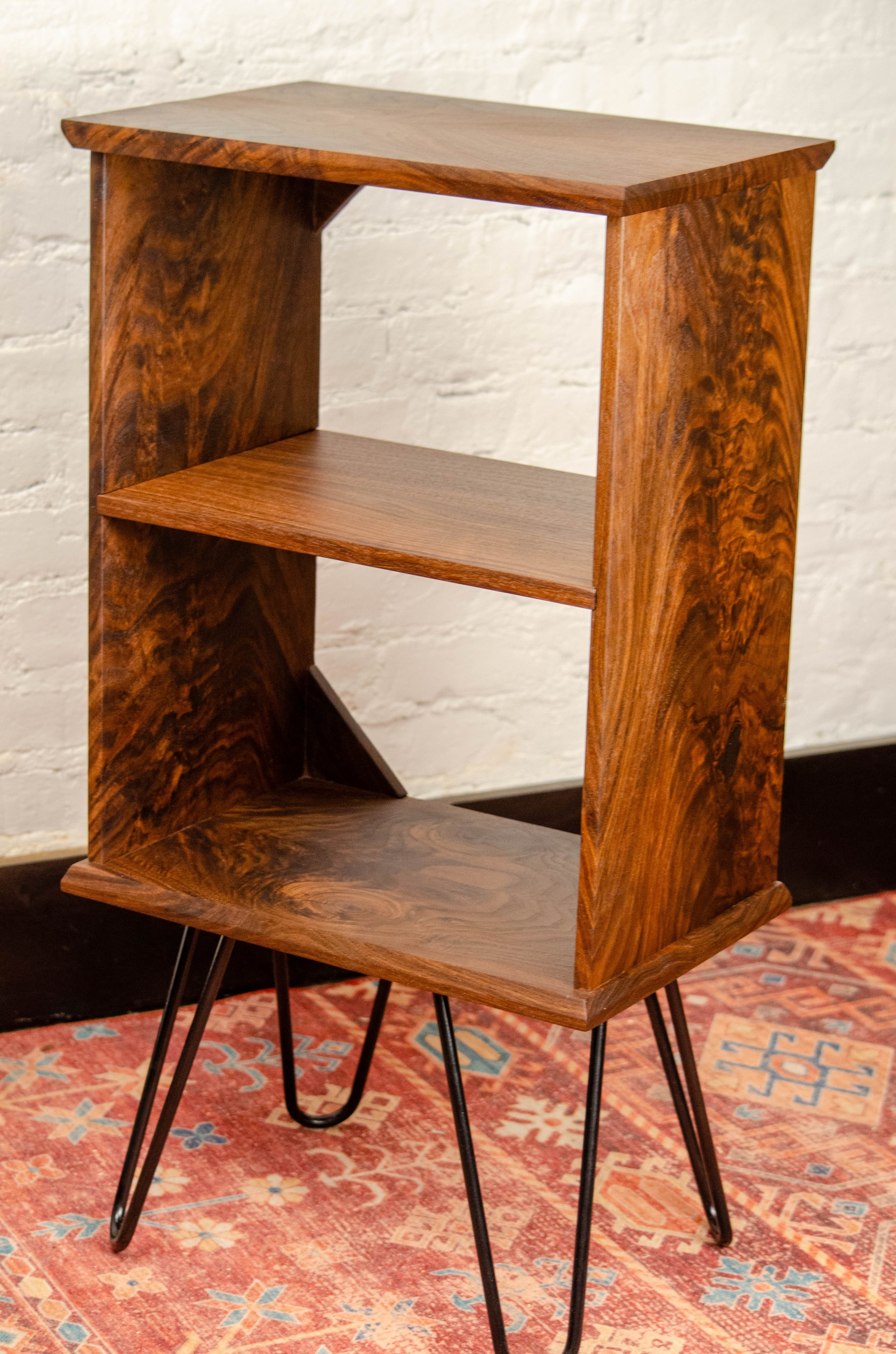 We created this stunning Black Walnut Bookcase / End Table for a client. This is a standard design that we offer in various wood types if you'd like one made in another wood.