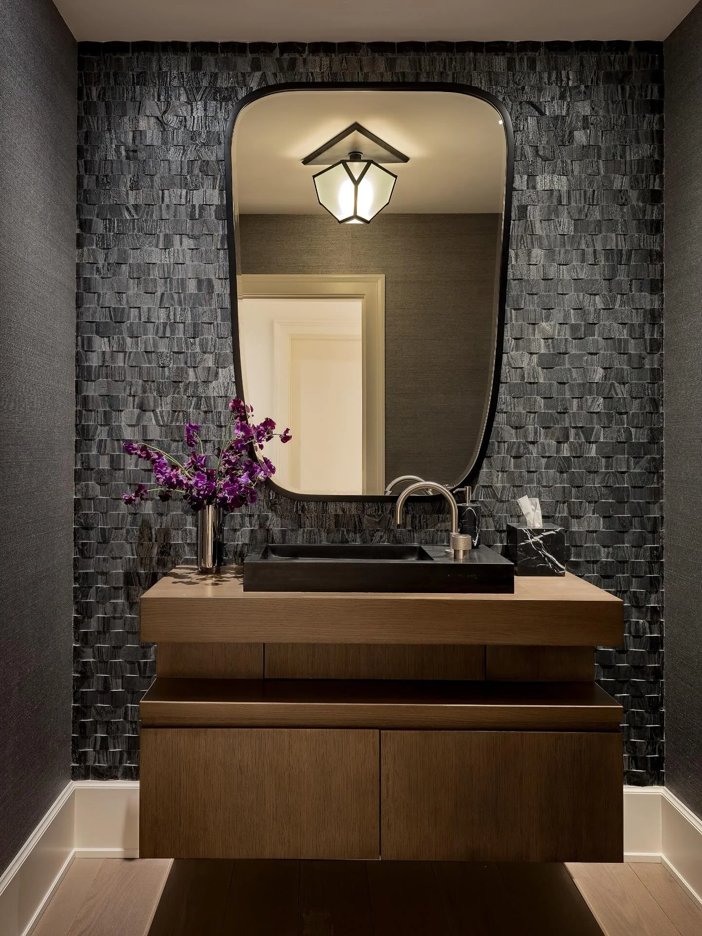 Dark and stormy vibes for this powder room

Photography by: @michaeljleephotography