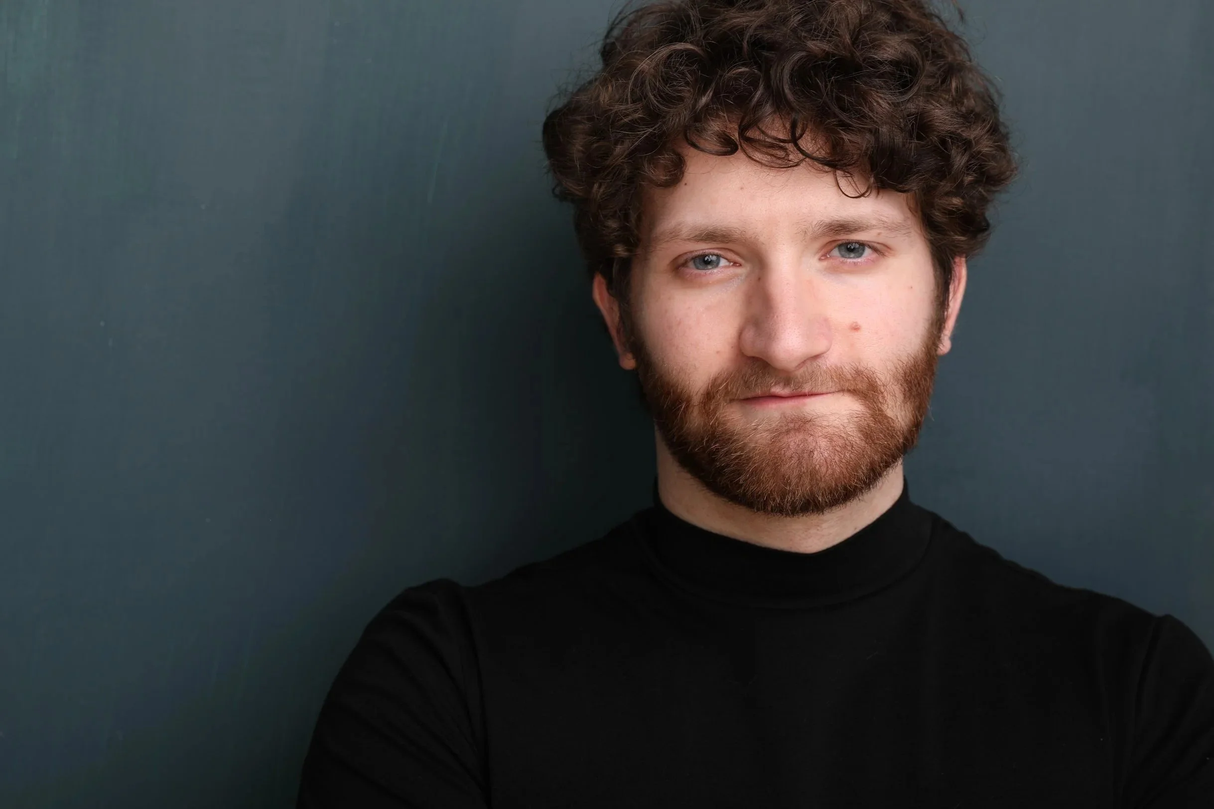 A headshot of actor PJ Moran