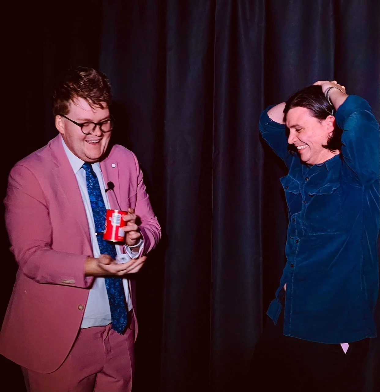 Australian Champion Magician Josh Staley performing a stage magic feature show at the Melbourne International Comedy Festival with an amazed audience volunteer.