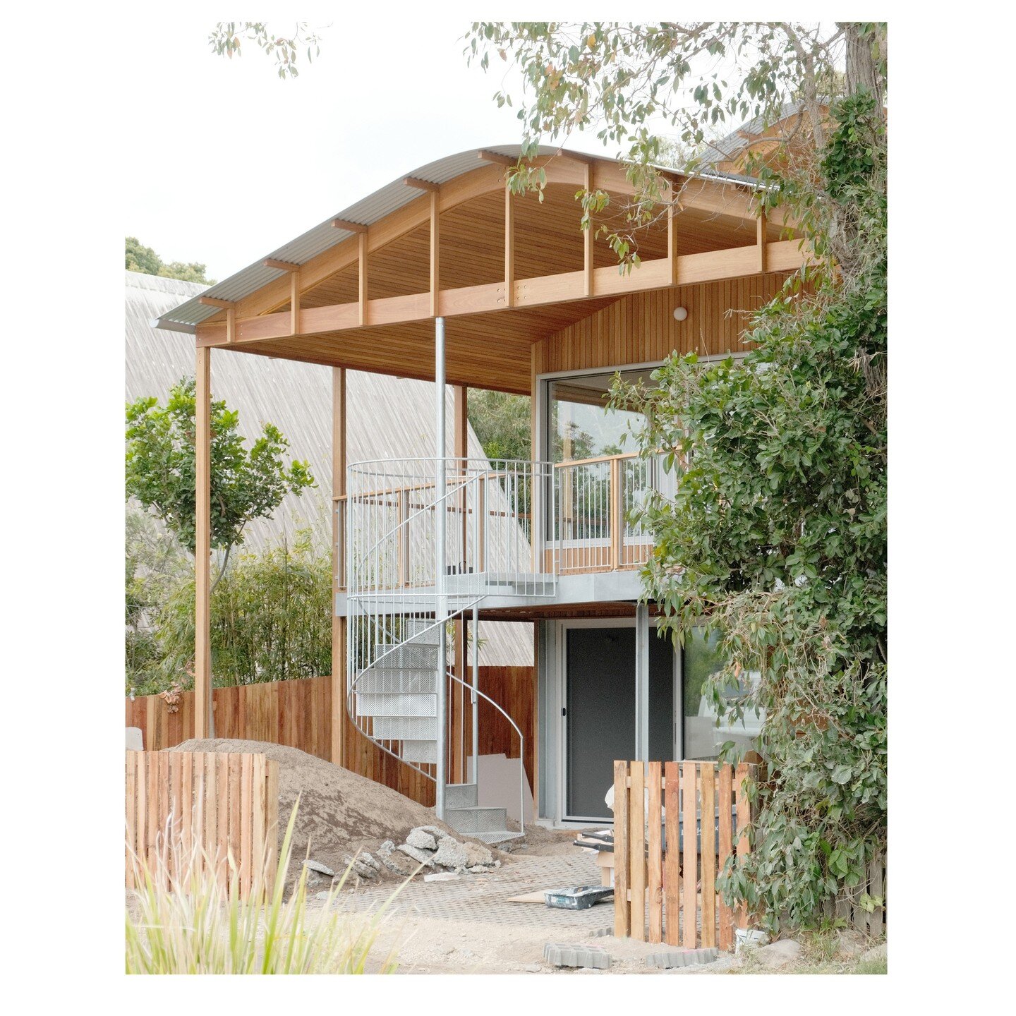 Our take on the external veranda stair shown in conversation with just some of the great entry stairs along the streets of Brunswick Heads. The spiral plunges into the garden below, and provides an arbour for greenery to climb around.

This shot also