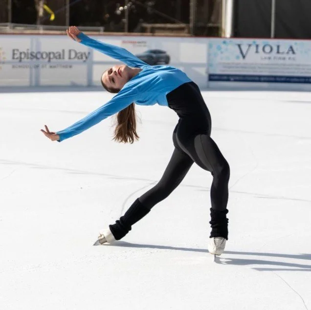 Natalie Renier-Bertolucci in an elegant Ina-Bauer skating gliding pose.