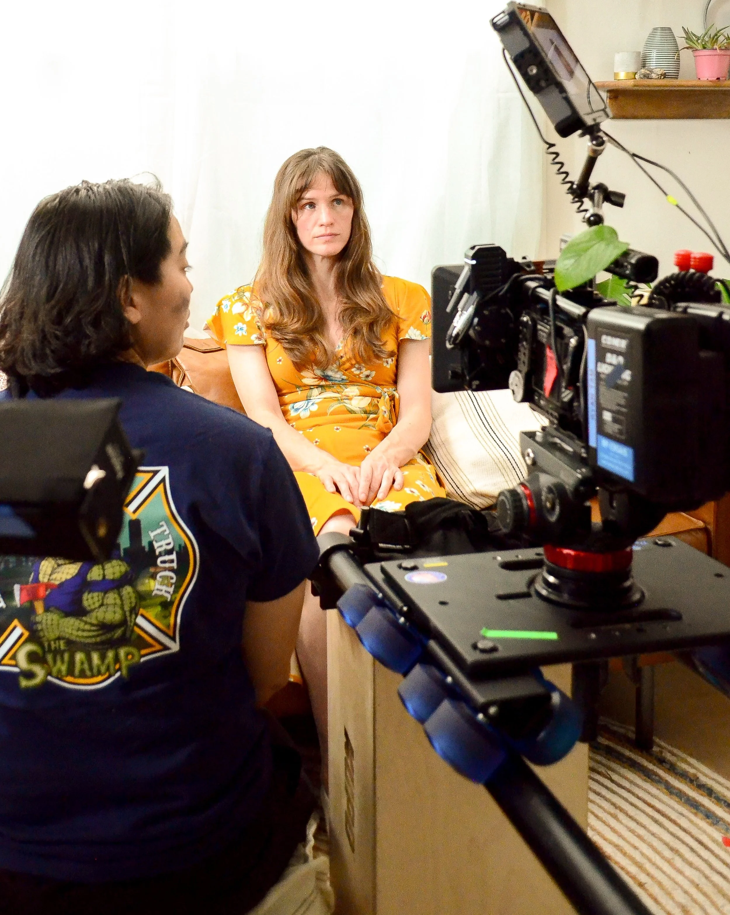 Natalie Renier-Bertolucci through the film camera on-set.