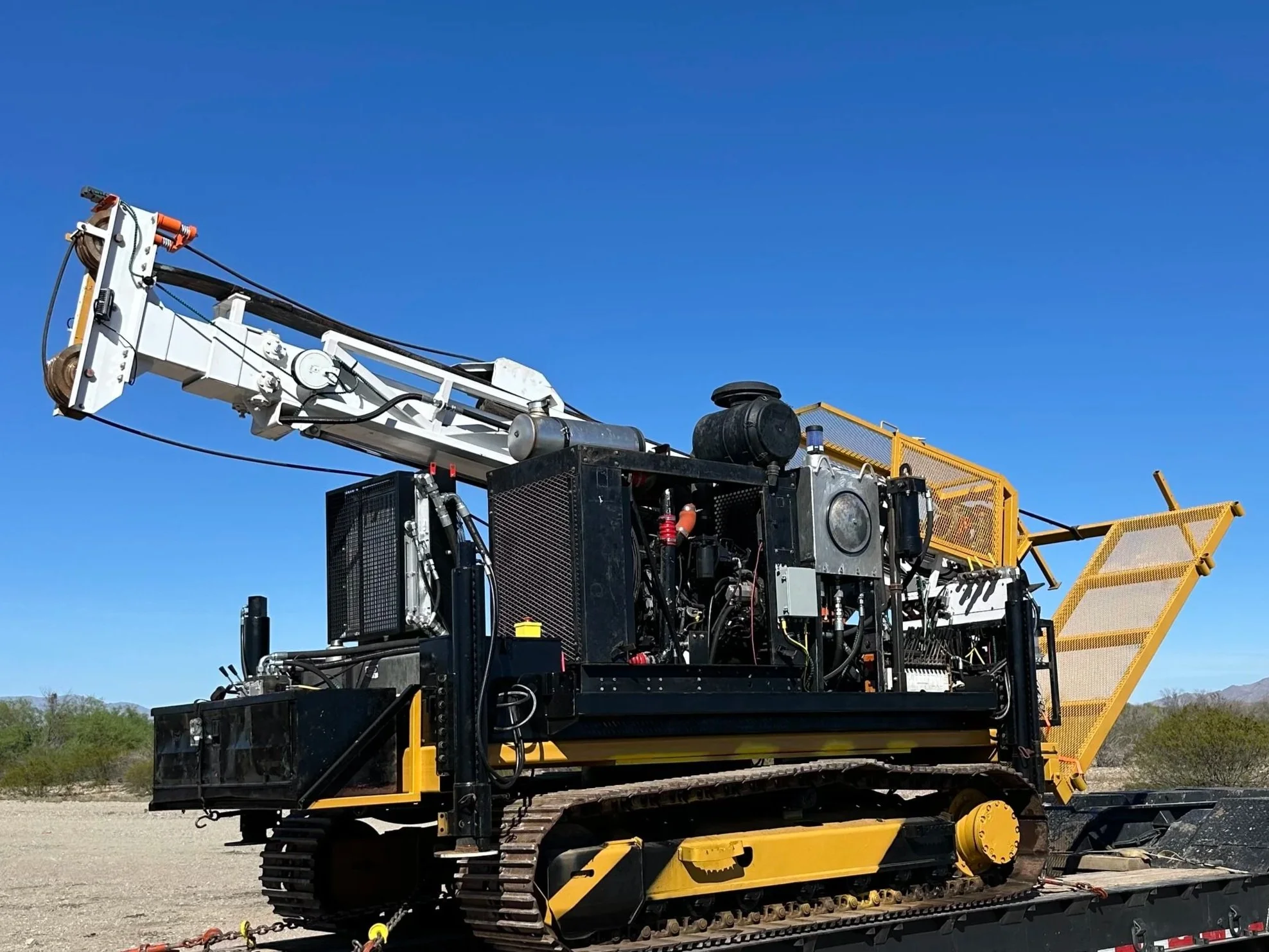 Track-mounted diamond core drilling rig in operation, used by KP Exploration for mineral exploration and core recovery in the Western US.