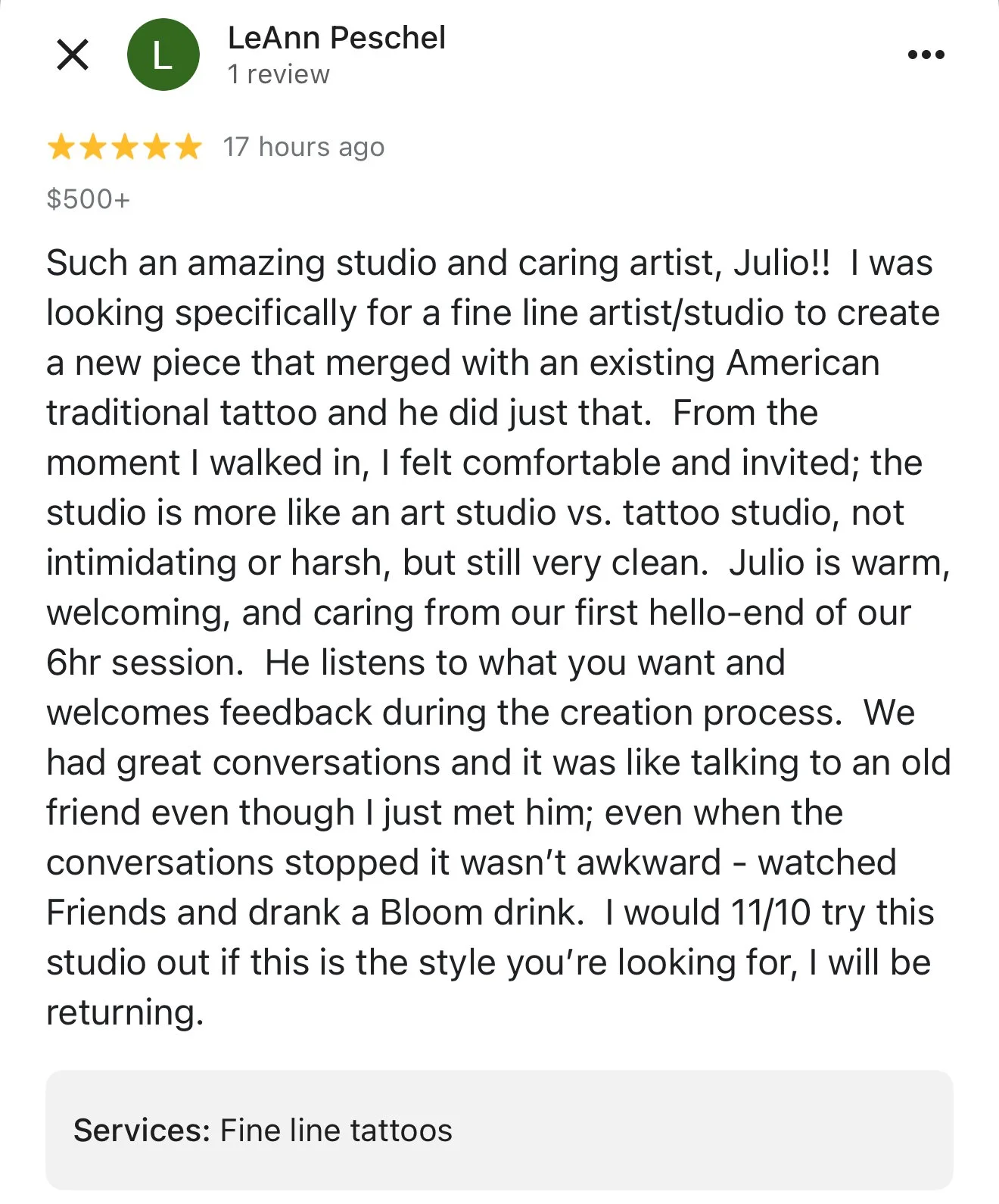 Customer review for a tattoo studio, praising the artist Julio for his fine line work, welcoming atmosphere, and attentive listening during the tattoo creation process.