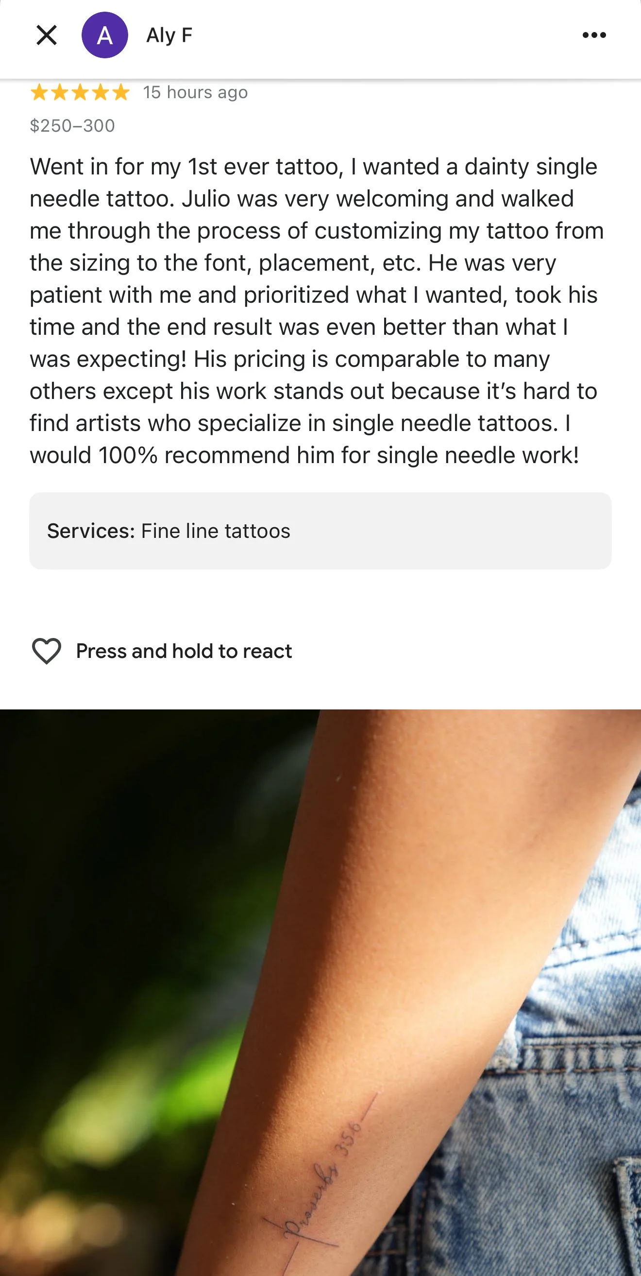 Close-up of a person's forearm with a small, fine-line tattoo.