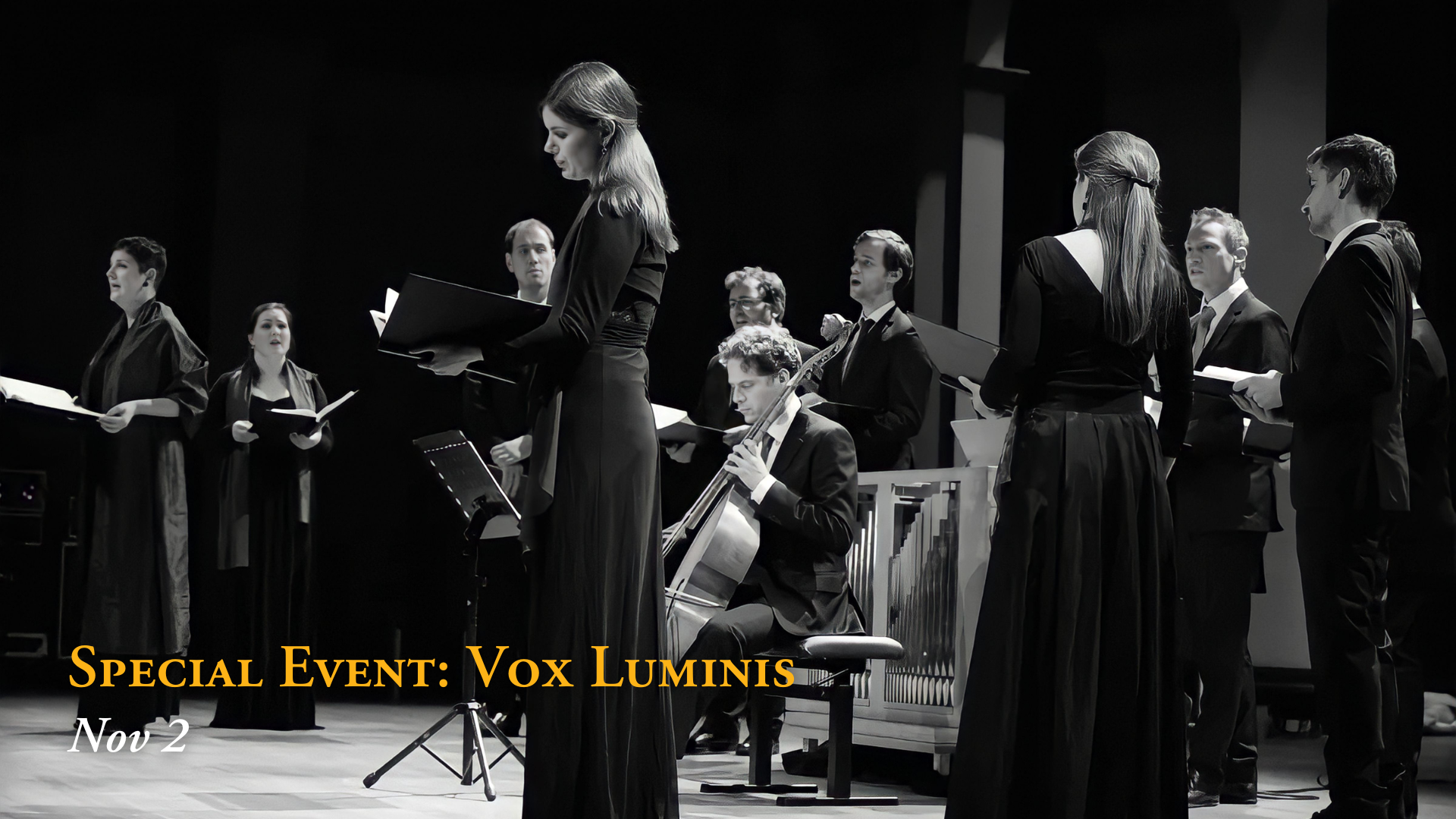 A group of singers and a musician with a guitar on stage during a concert, with text overlay reading 'Special Event: Vox Luminis Nov 2'.