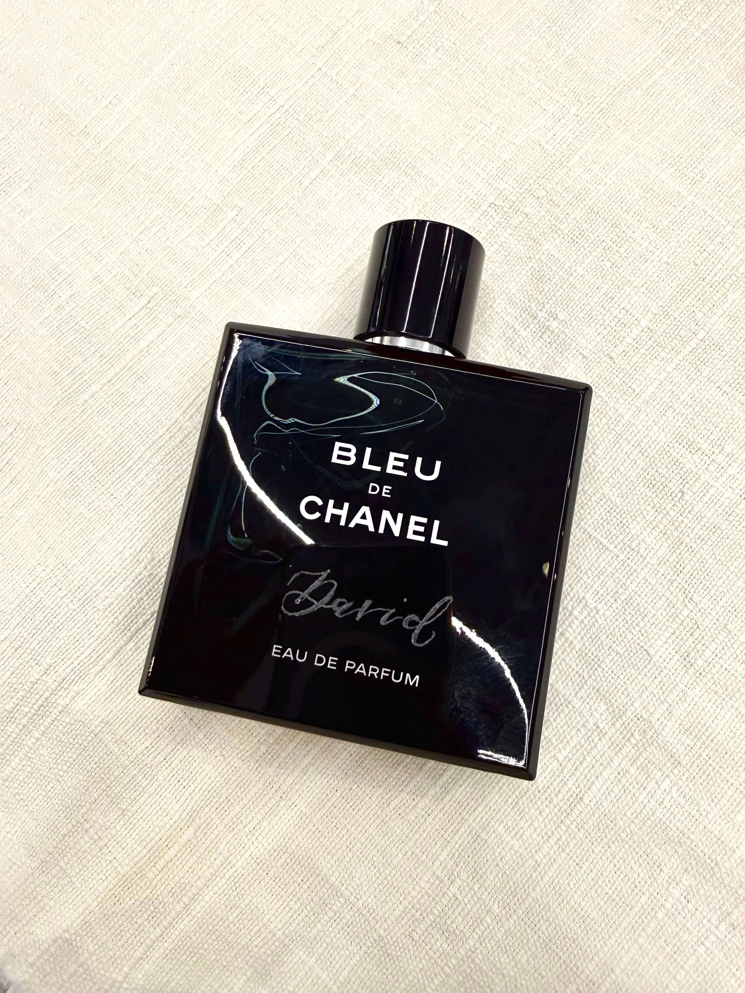 Live hand engraving on a Bleu de Chanel perfume bottle for a luxury brand activation in Northern California