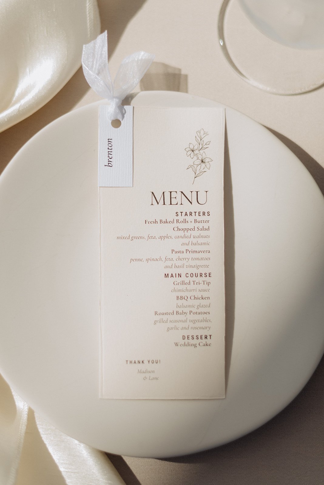 Wedding reception table settings with dinner menu